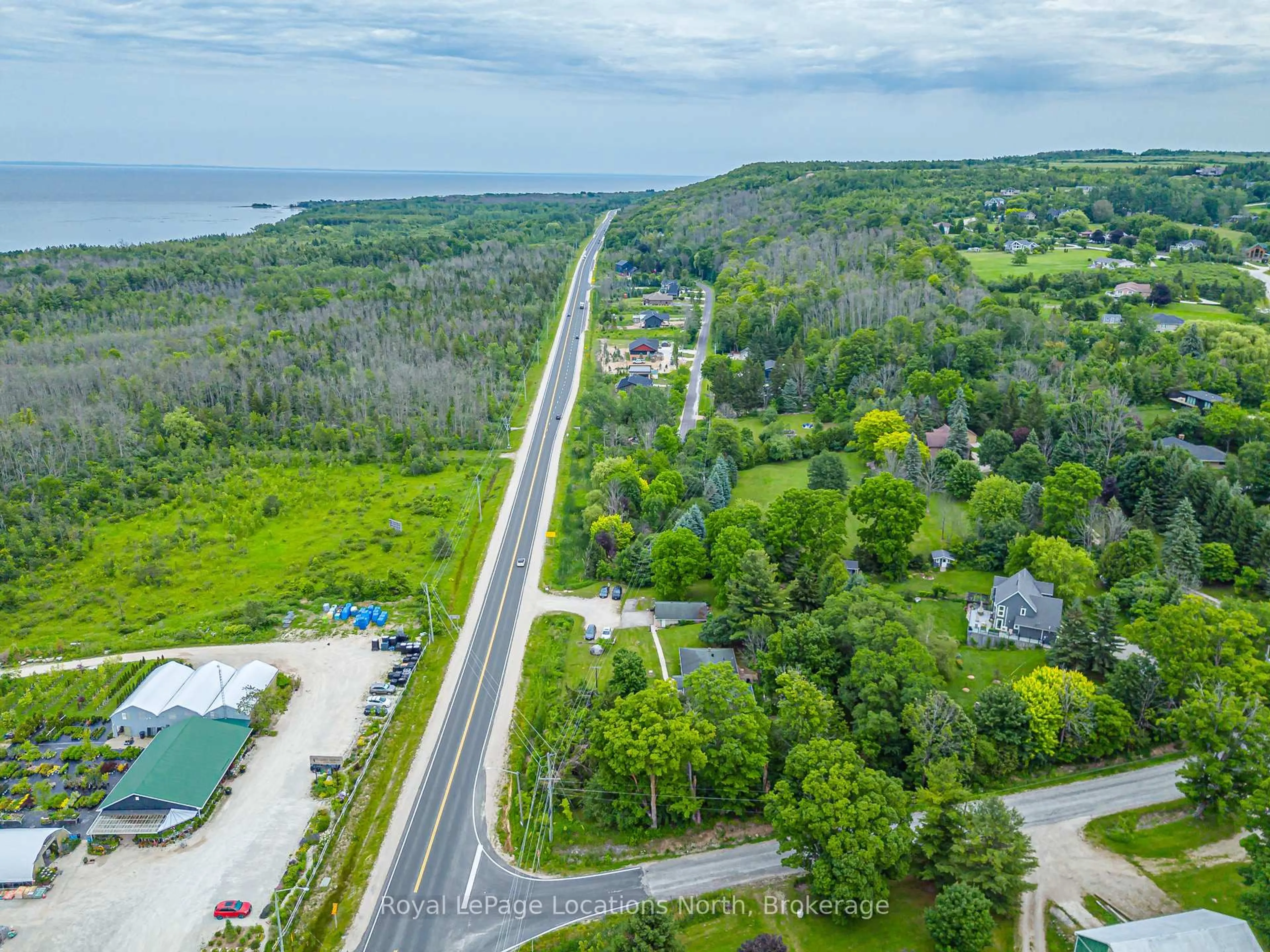 A pic from outside/outdoor area/front of a property/back of a property/a pic from drone, water/lake/river/ocean view for 206720 Highway 26, Meaford Ontario N4L 1W7