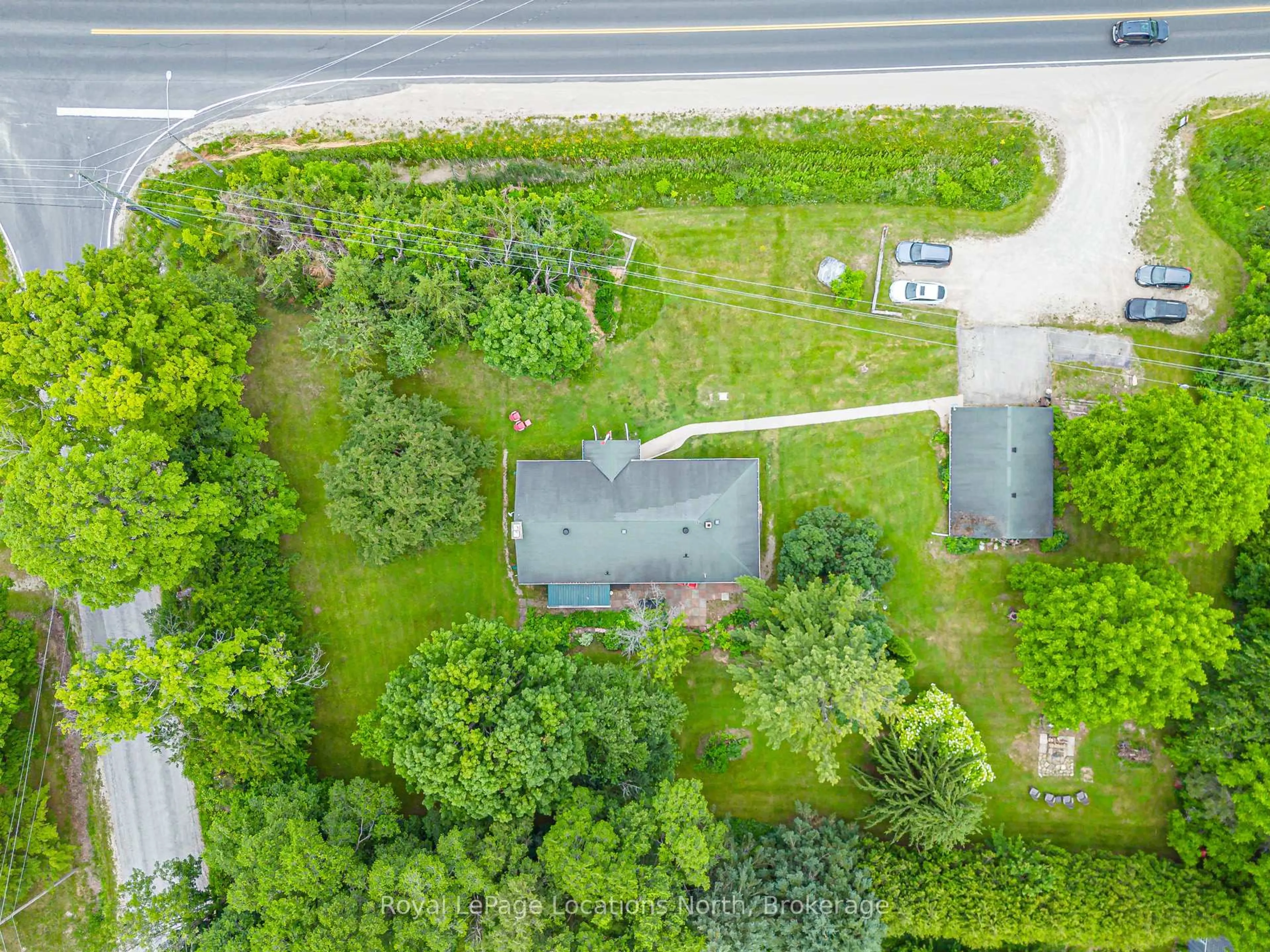 A pic from outside/outdoor area/front of a property/back of a property/a pic from drone, street for 206720 Highway 26, Meaford Ontario N4L 1W7