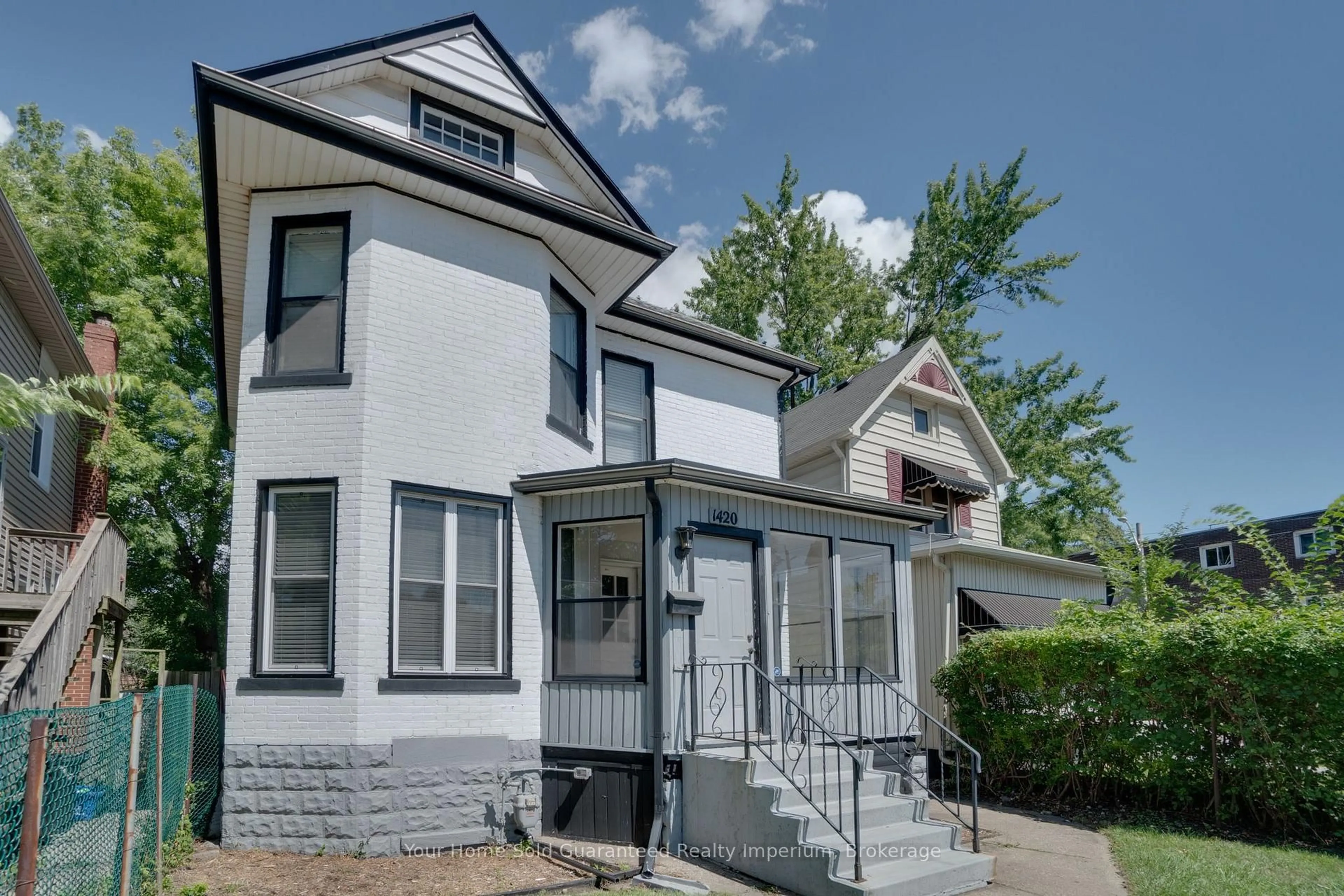 Home with vinyl exterior material, street for 1420 University Ave, Windsor Ontario N9B 1B7