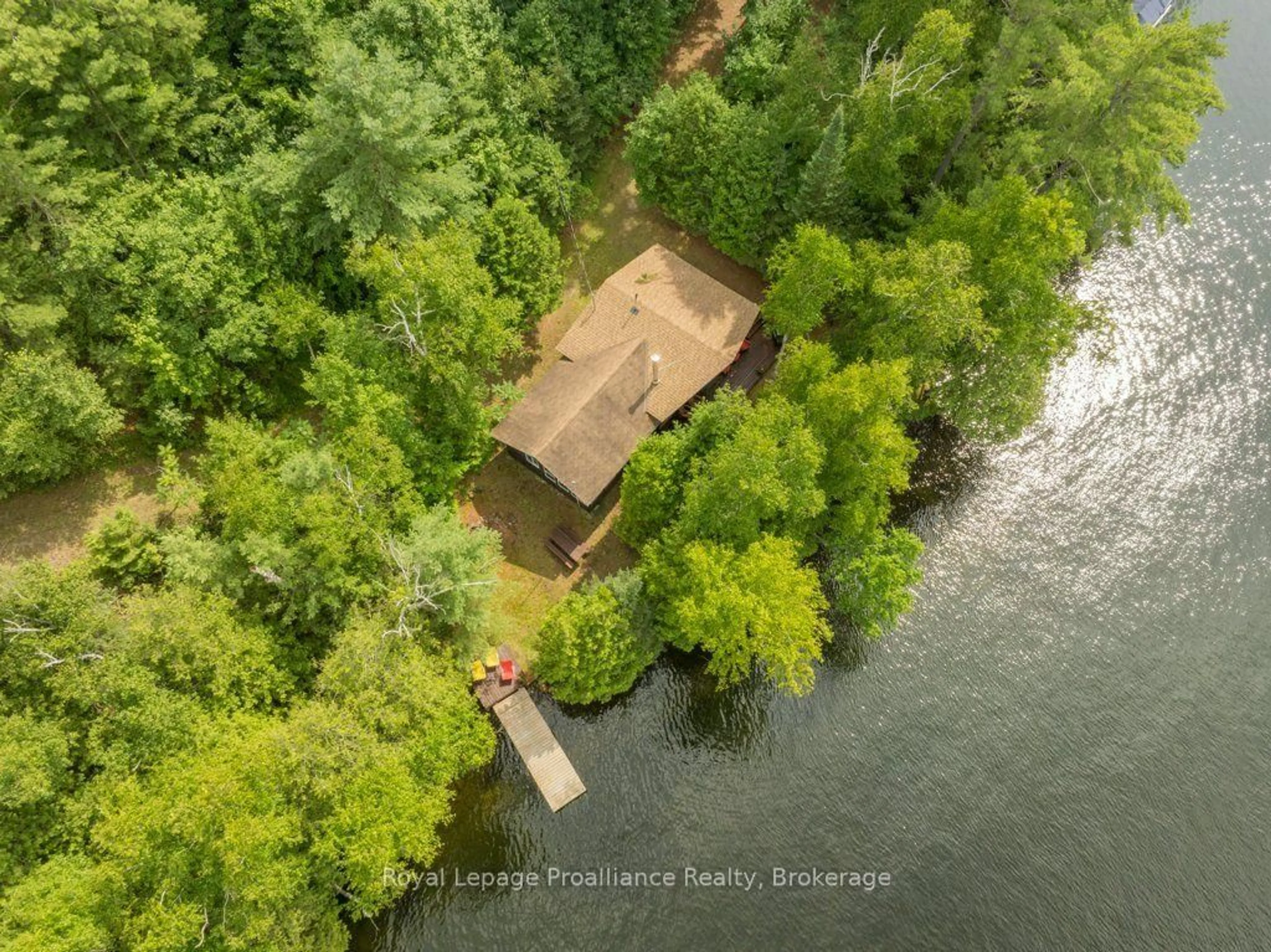 A pic from outside/outdoor area/front of a property/back of a property/a pic from drone, water/lake/river/ocean view for 1021 Blue Jay Lane, Arden Ontario K0H 1B0