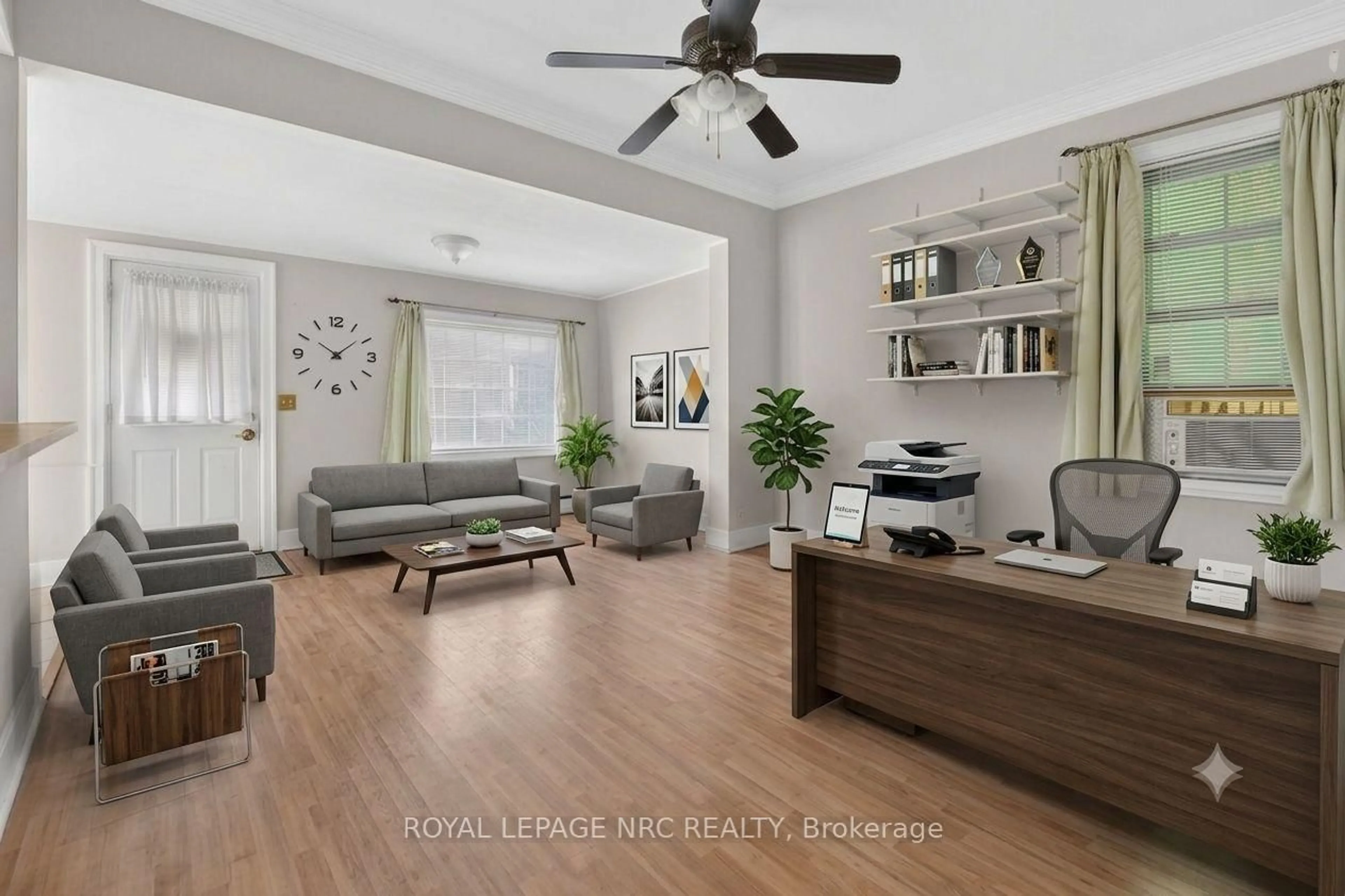 Living room with furniture, wood/laminate floor for 177 James St, St. Catharines Ontario L2R 5C4