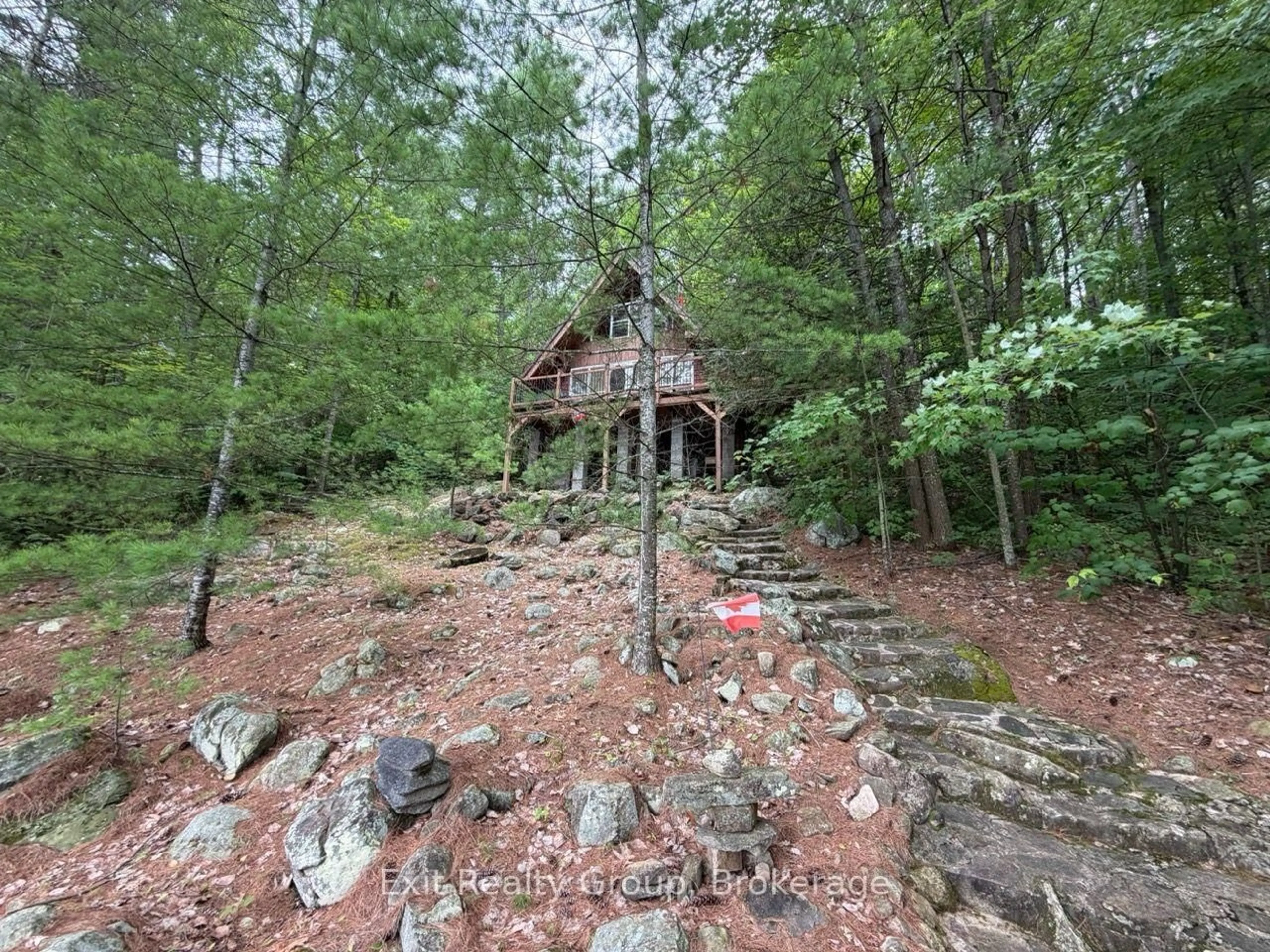 A pic from outside/outdoor area/front of a property/back of a property/a pic from drone, forest/trees view for 2010 Shabomeka Lake, Cloyne Ontario K0H 1K0