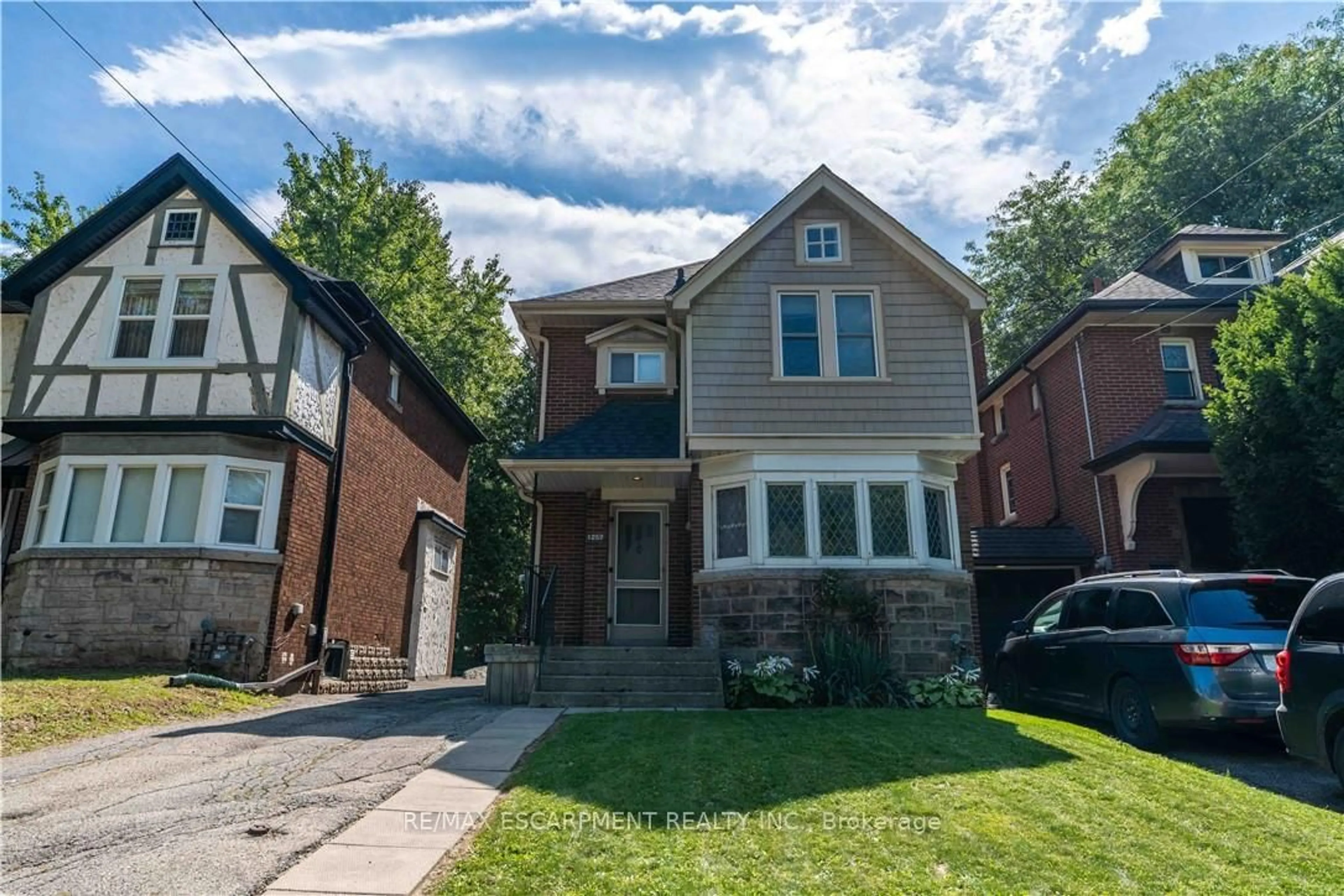 Home with brick exterior material, street for 1257 King St, Hamilton Ontario L8S 1M5
