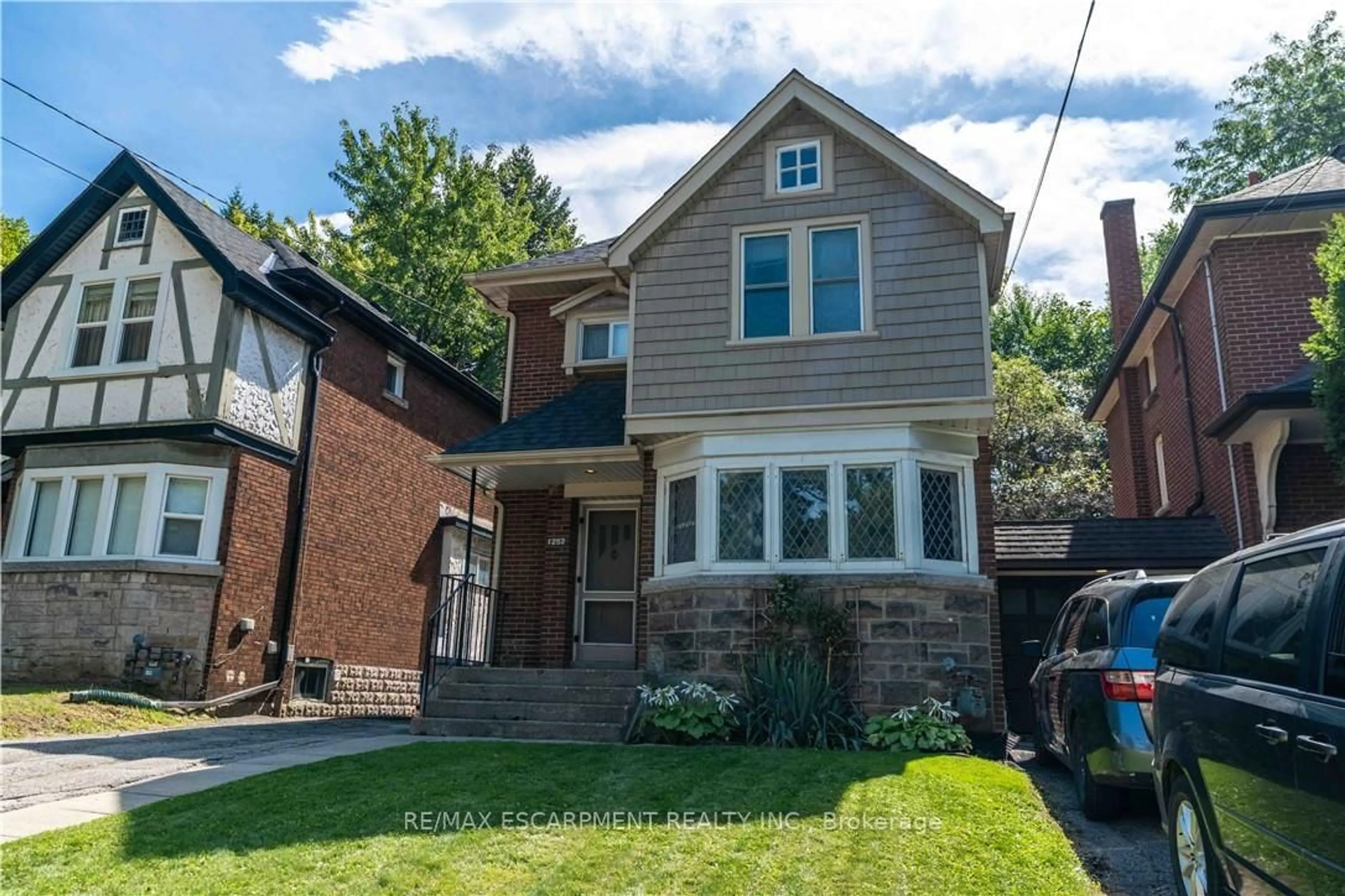 Home with brick exterior material, street for 1257 King St, Hamilton Ontario L8S 1M5