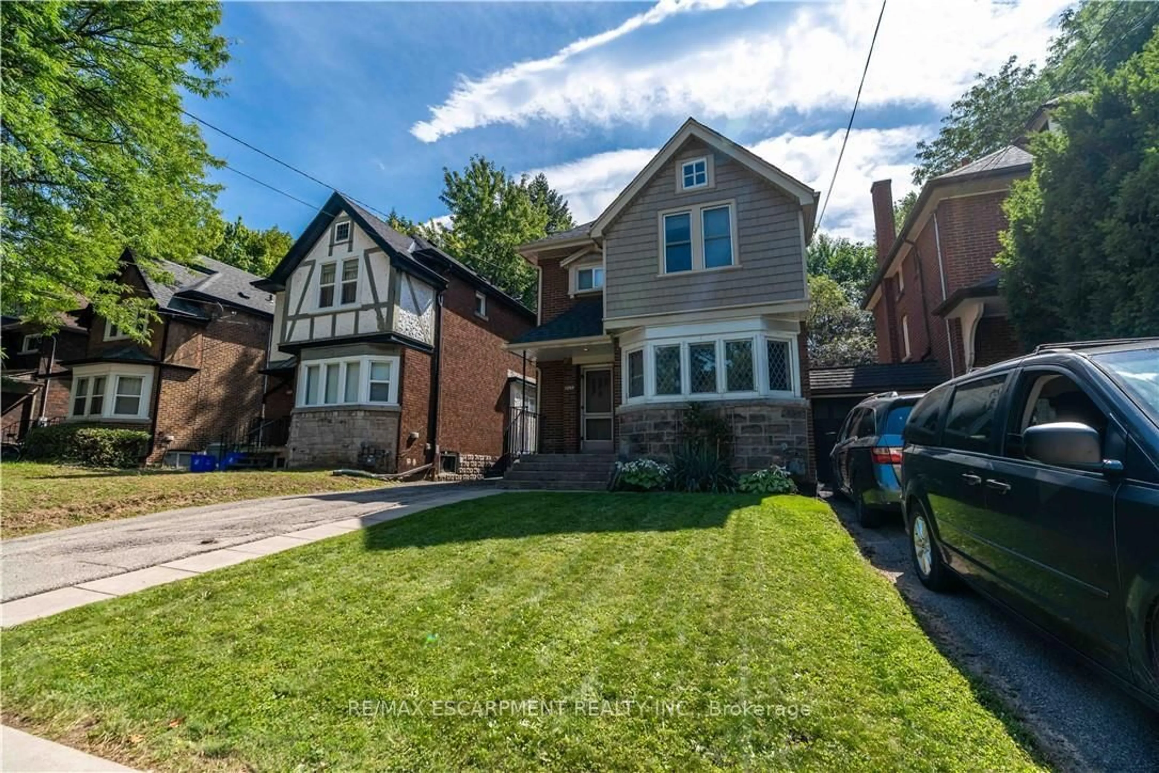 Home with brick exterior material, street for 1257 King St, Hamilton Ontario L8S 1M5