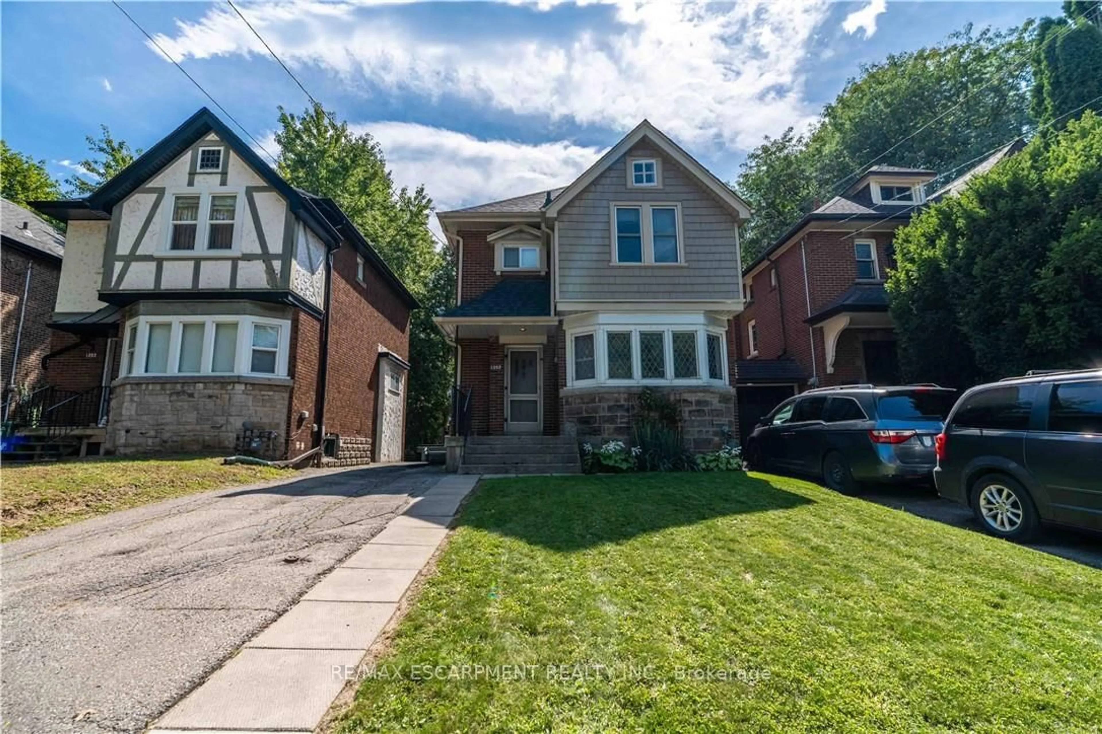 Home with brick exterior material, street for 1257 King St, Hamilton Ontario L8S 1M5