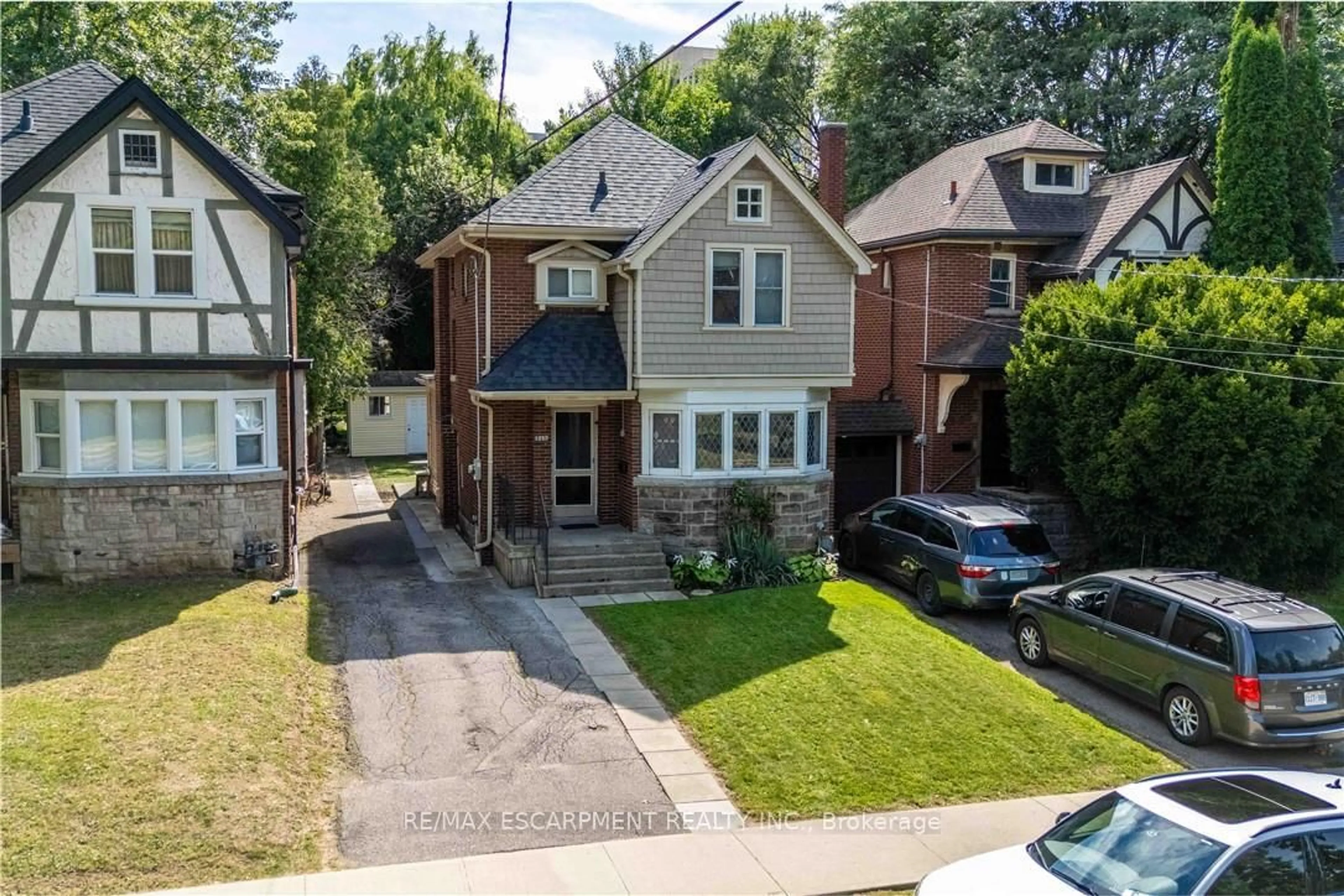 A pic from outside/outdoor area/front of a property/back of a property/a pic from drone, street for 1257 King St, Hamilton Ontario L8S 1M5