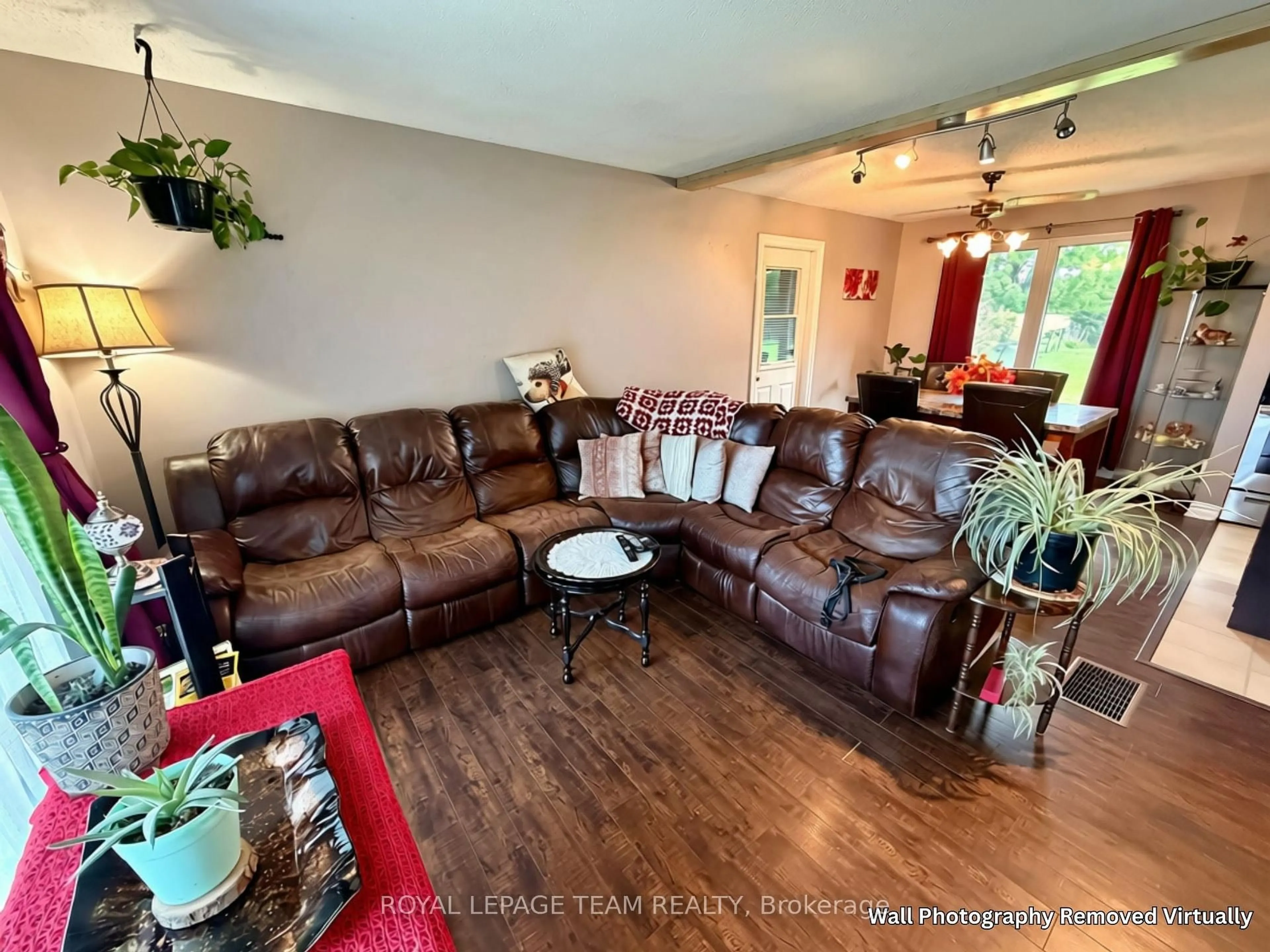 Living room with furniture, wood/laminate floor for 670 Van Buren St, North Grenville Ontario K0G 1J0