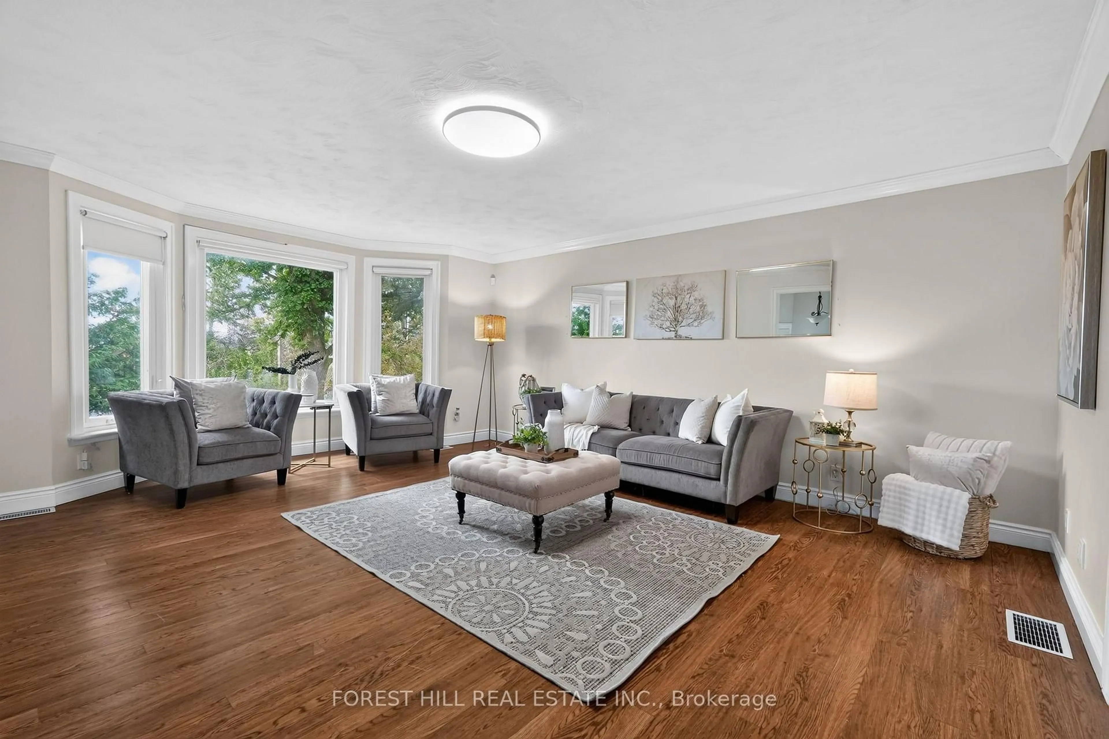 Living room with furniture, wood/laminate floor for 1743 Morton 10th Line, Cavan Monaghan Ontario L0A 1C0
