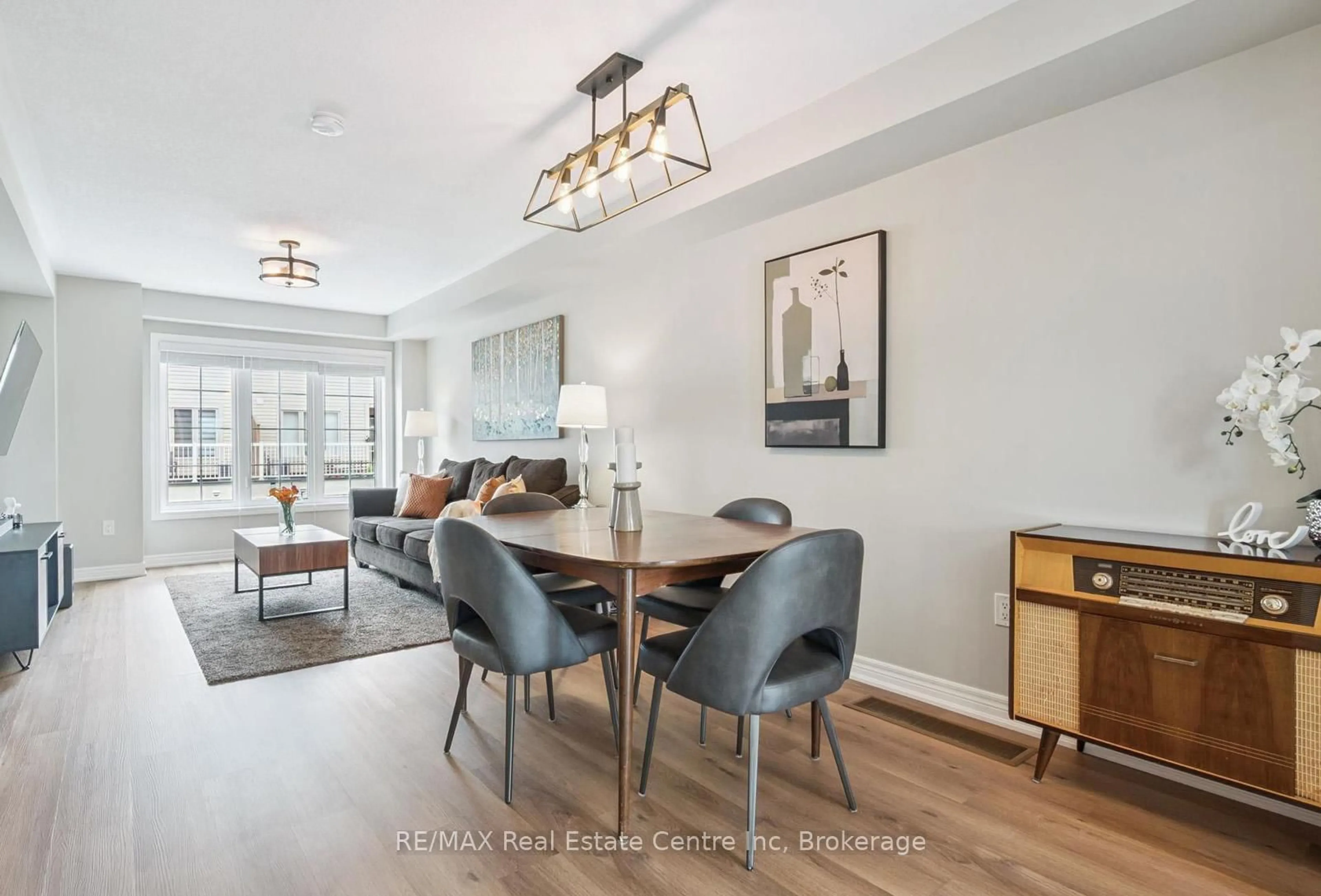 Living room with furniture, wood/laminate floor for 395 Linden Dr #2, Cambridge Ontario N3H 0C8