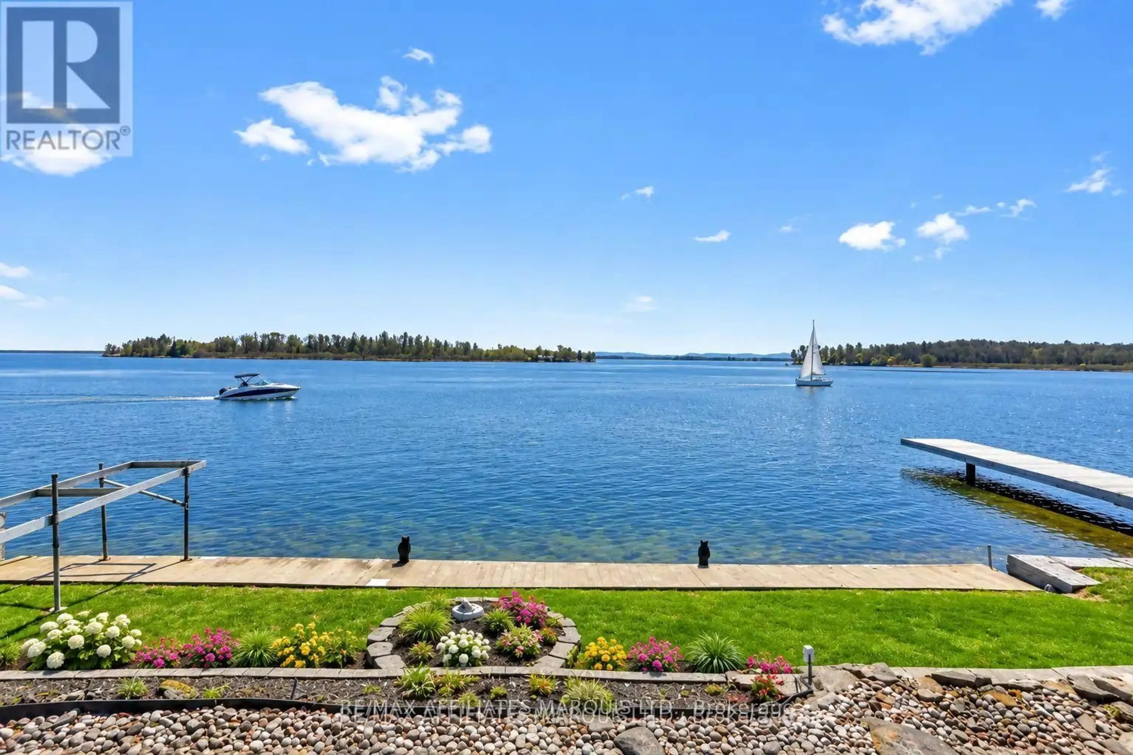 A pic from outside/outdoor area/front of a property/back of a property/a pic from drone, water/lake/river/ocean view for 19564 County Rd 2 Rd, South Glengarry Ontario K0C 1E0