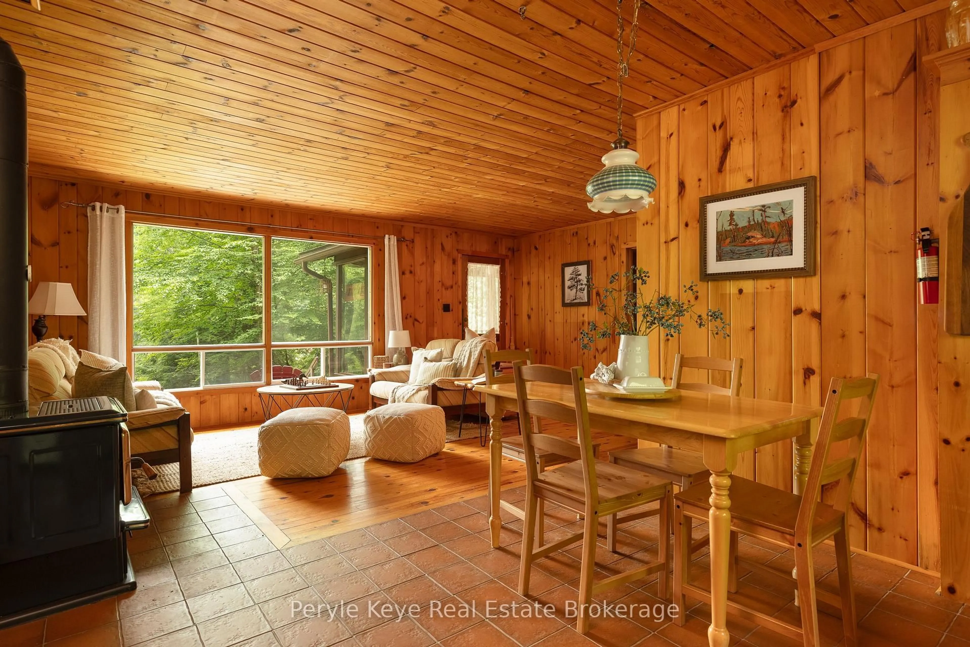 Living room with furniture, wood/laminate floor for 1057 H R S Rd, Bracebridge Ontario P1L 1X1