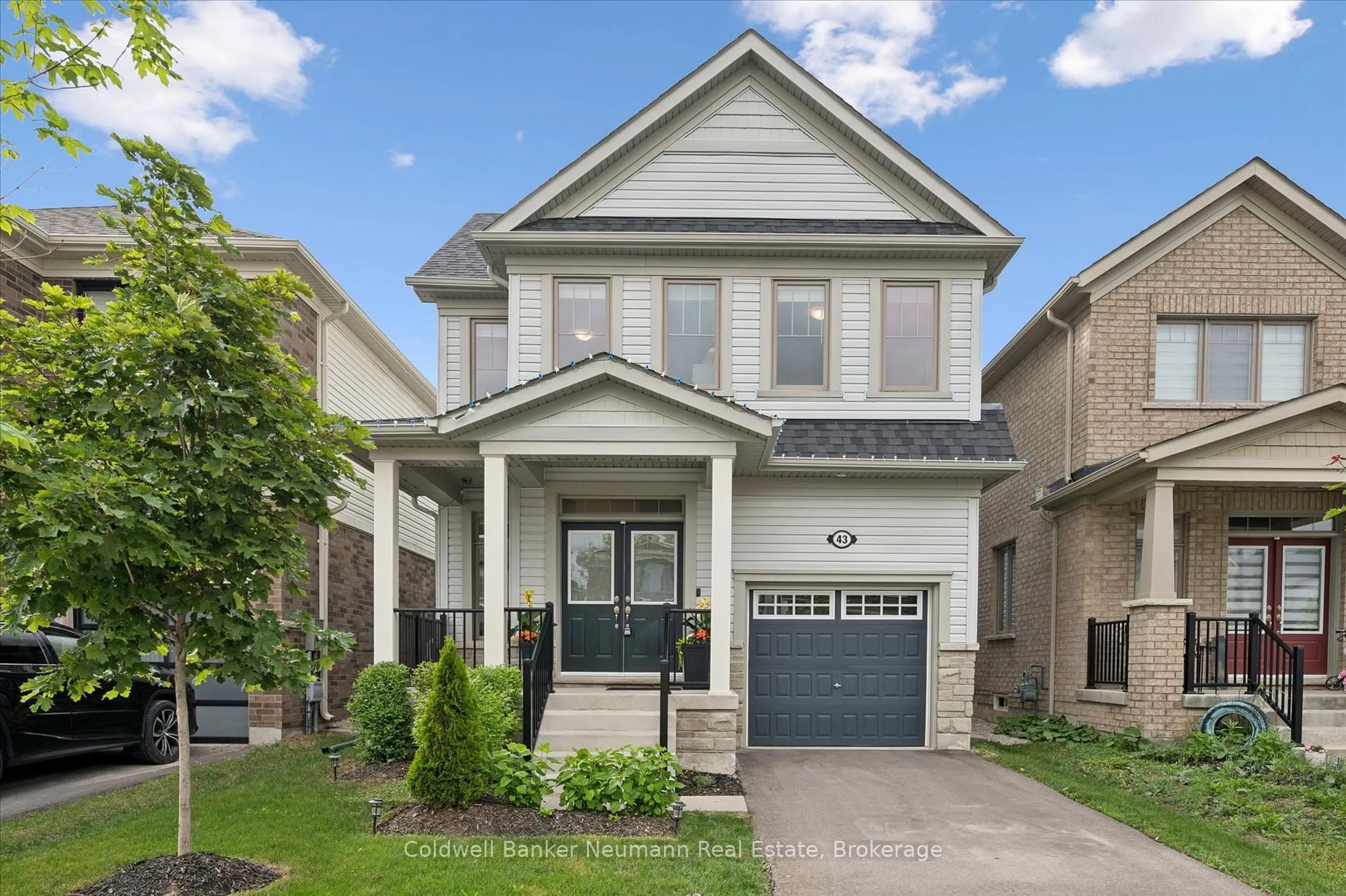 Home with vinyl exterior material, street for 43 Harpin Way, Centre Wellington Ontario N1M 0H8