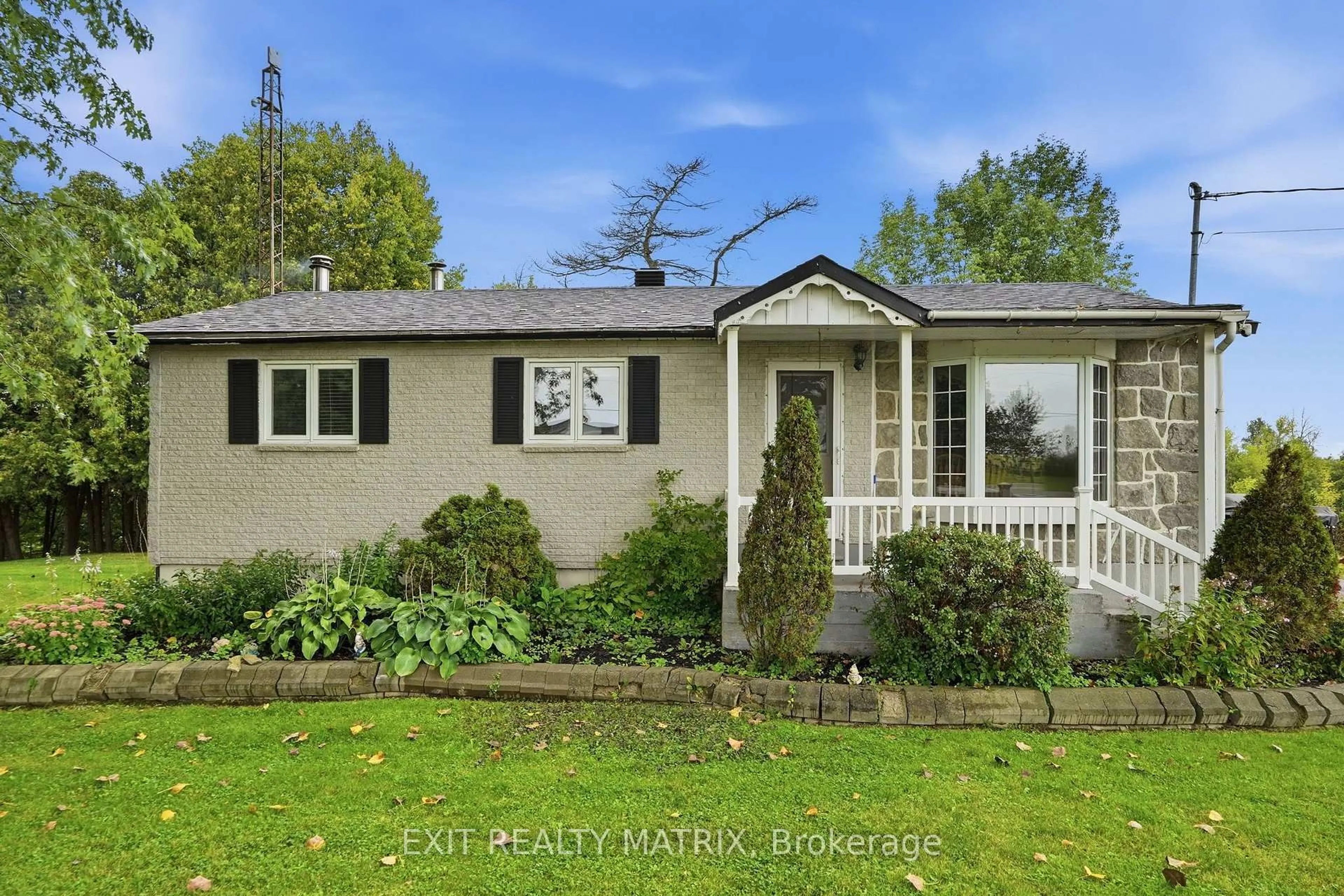 Home with vinyl exterior material, street for 22215 Laggan-Glenelg Rd, North Glengarry Ontario K0B 1E0