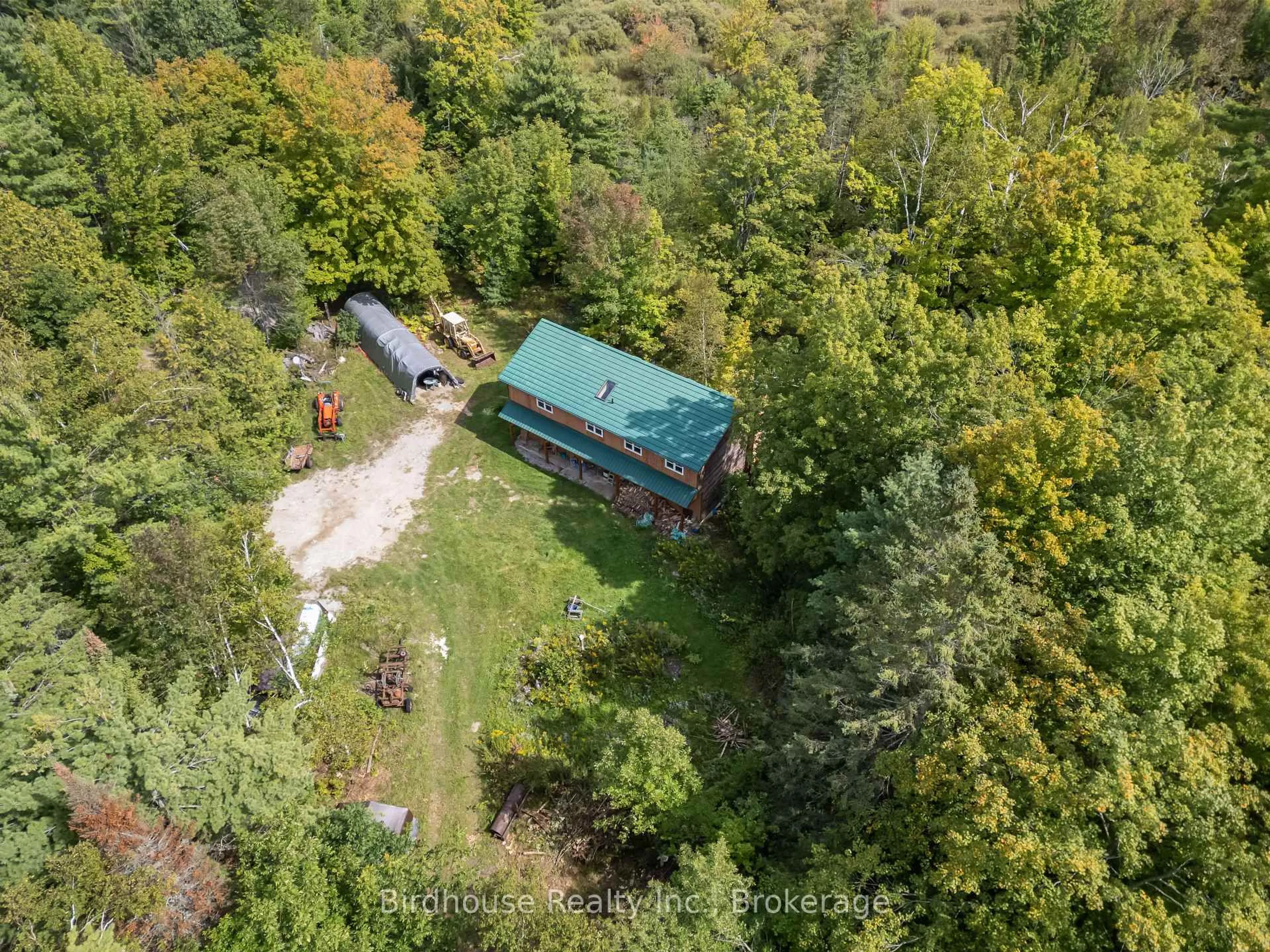 A pic from outside/outdoor area/front of a property/back of a property/a pic from drone, forest/trees view for 79 Honeysuckle Rd, Kawartha Lakes Ontario K0M 2B0