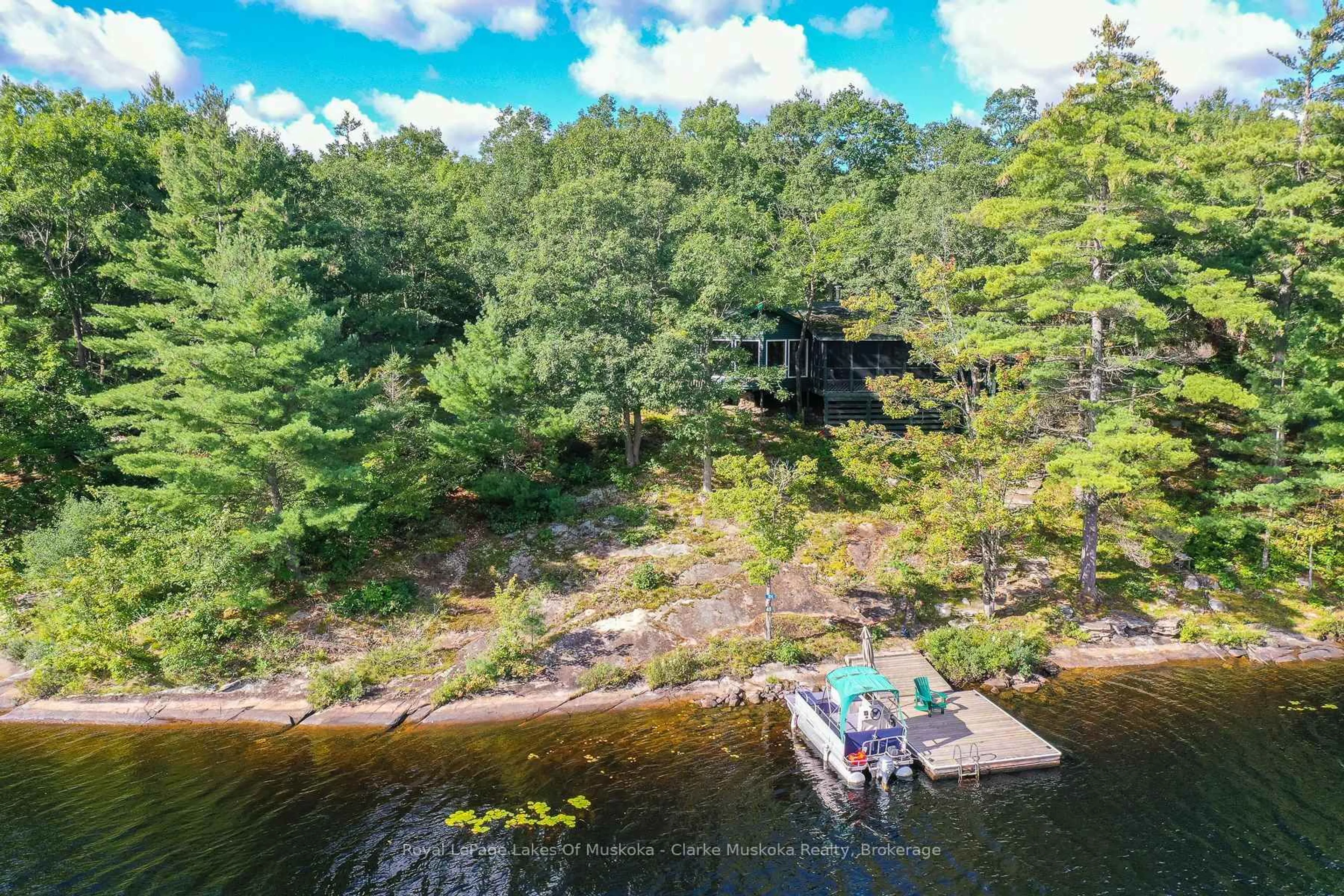 A pic from outside/outdoor area/front of a property/back of a property/a pic from drone, water/lake/river/ocean view for 23 Nine Mile Lake, Muskoka Lakes Ontario P0C 1M0