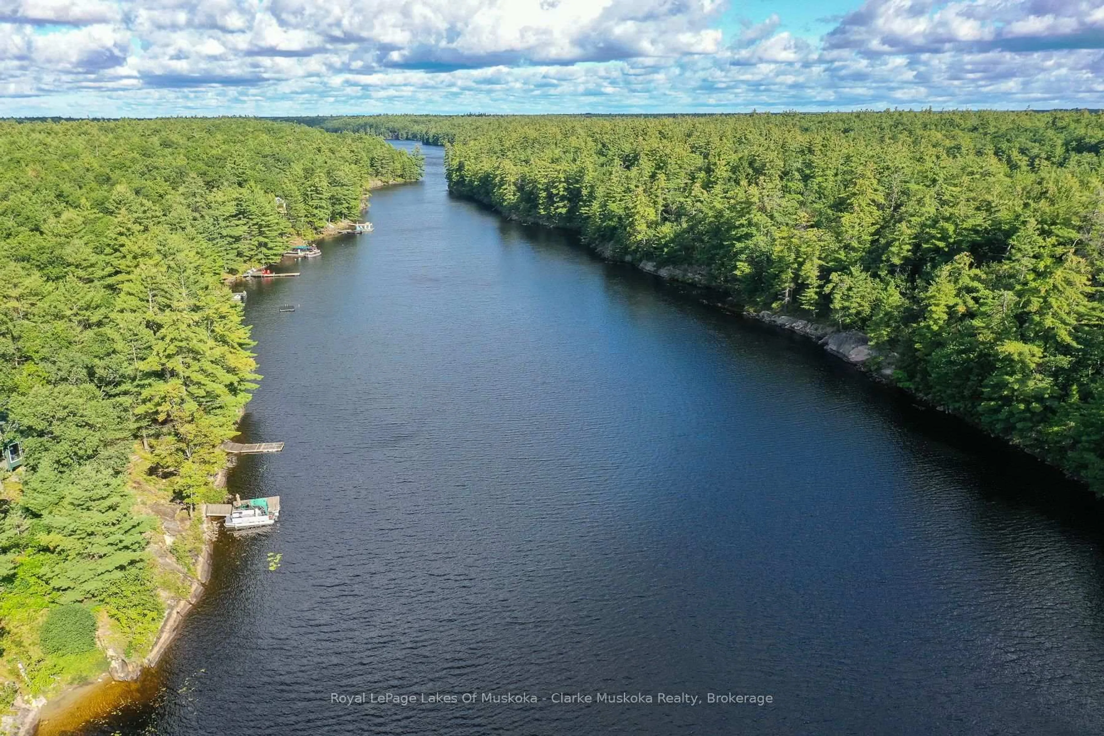 A pic from outside/outdoor area/front of a property/back of a property/a pic from drone, water/lake/river/ocean view for 23 Nine Mile Lake, Muskoka Lakes Ontario P0C 1M0
