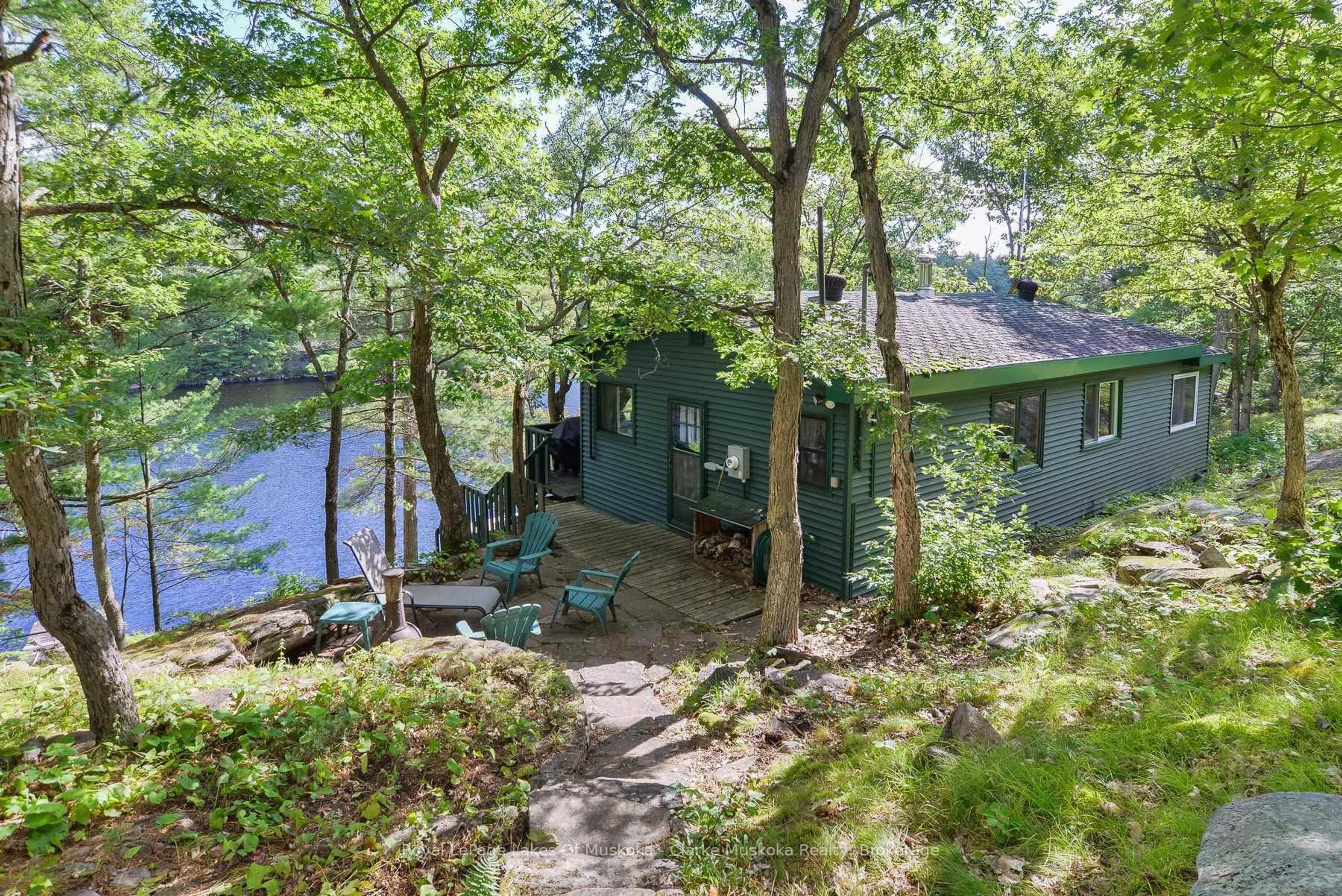 A pic from outside/outdoor area/front of a property/back of a property/a pic from drone, water/lake/river/ocean view for 23 Nine Mile Lake, Muskoka Lakes Ontario P0C 1M0