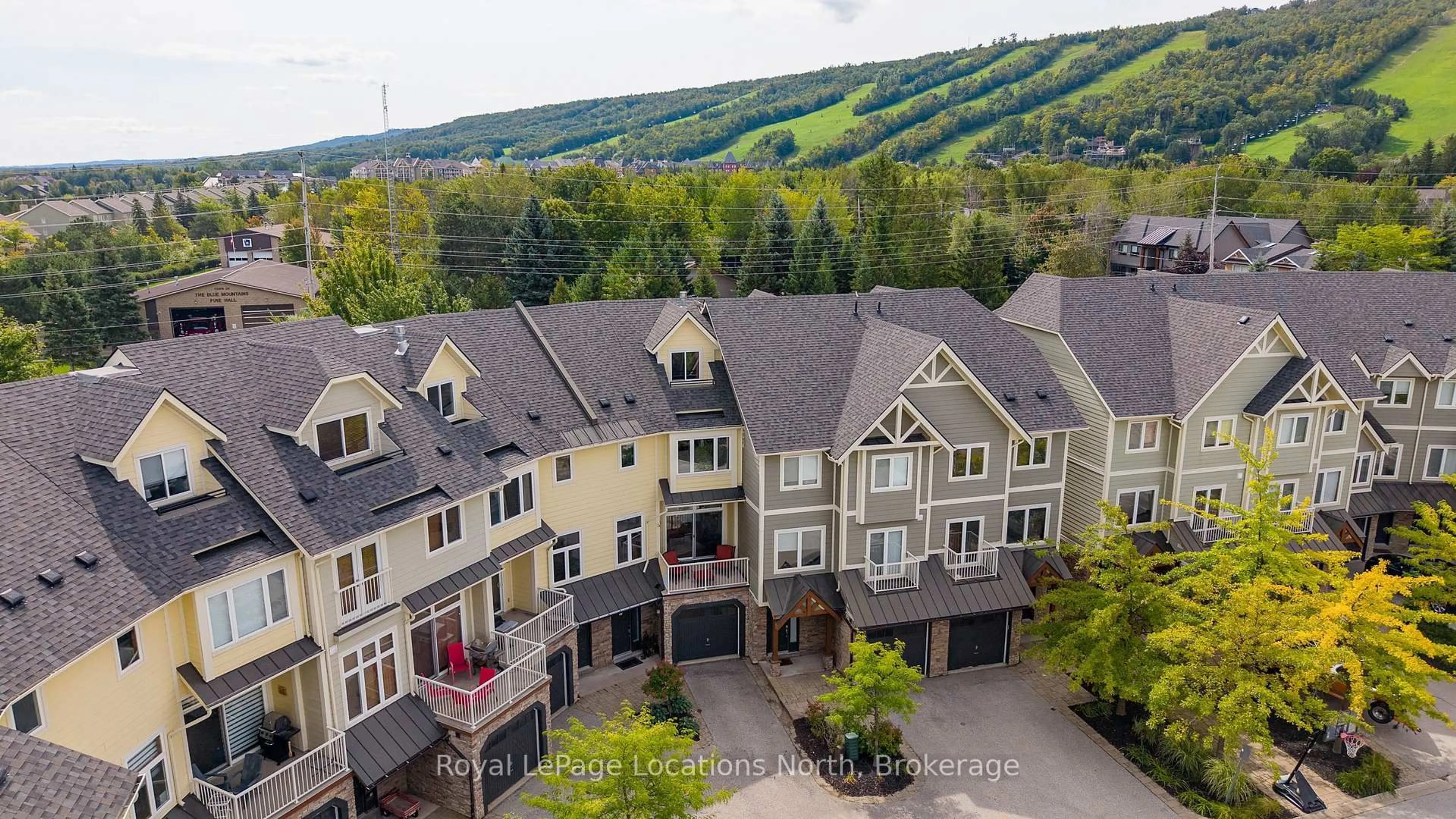 A pic from outside/outdoor area/front of a property/back of a property/a pic from drone, mountain view for 104 Farm Gate Rd #17, Blue Mountains Ontario L9Y 0L7