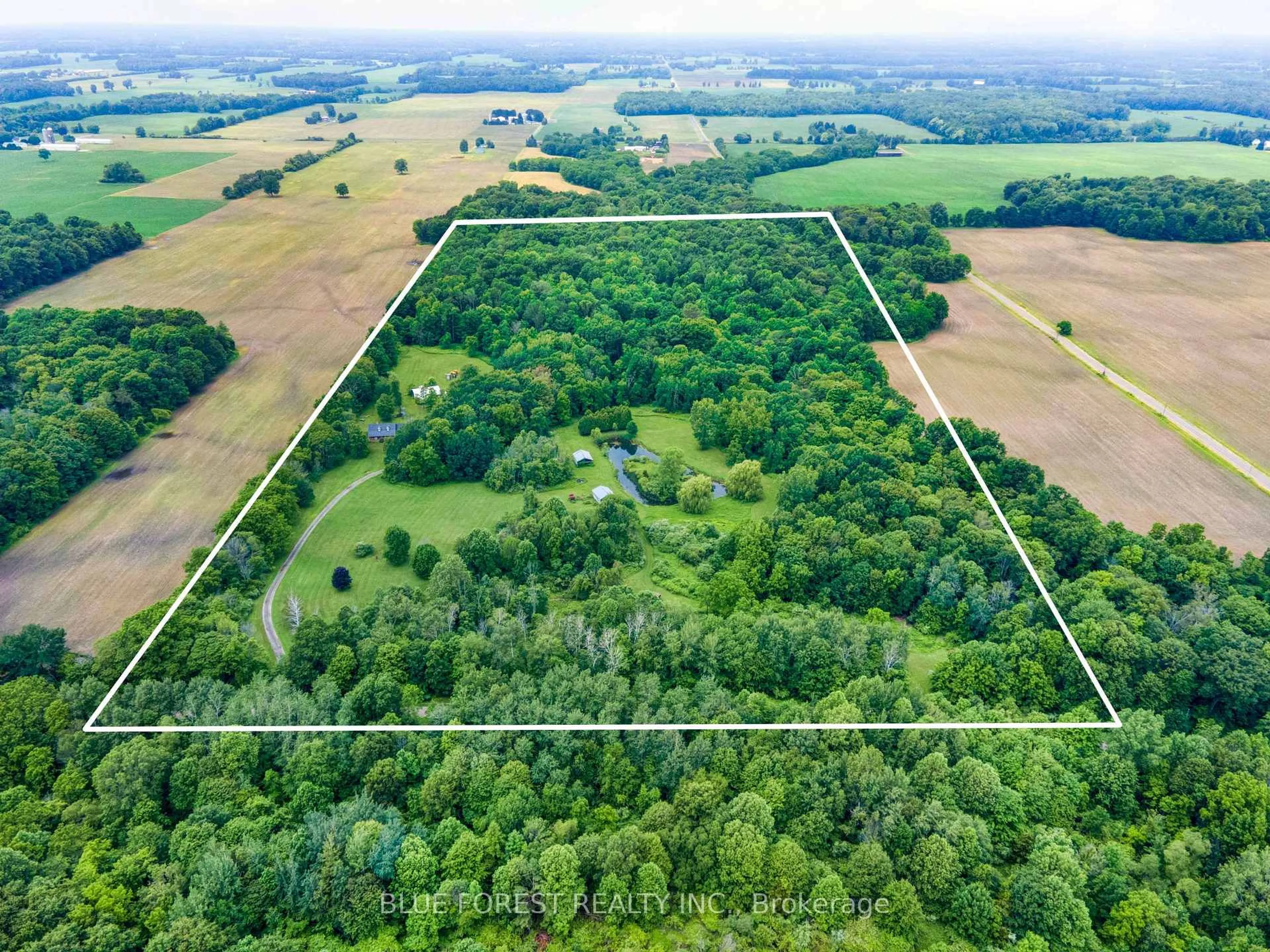 A pic from outside/outdoor area/front of a property/back of a property/a pic from drone, forest/trees view for 23706 Gray Line, West Elgin Ontario N0L 2C0