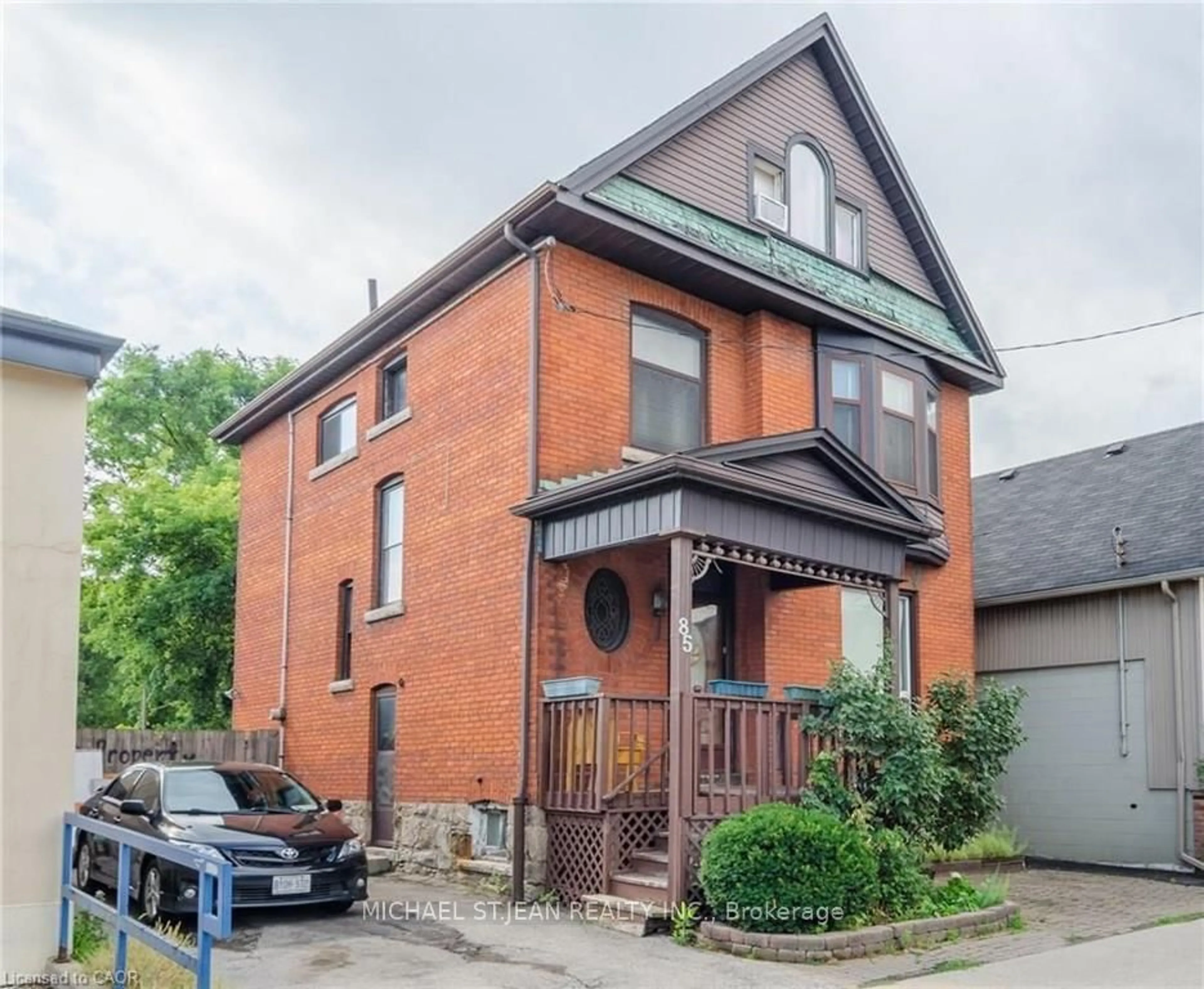 Home with brick exterior material, street for 85 Locke St, Hamilton Ontario L8P 4A3