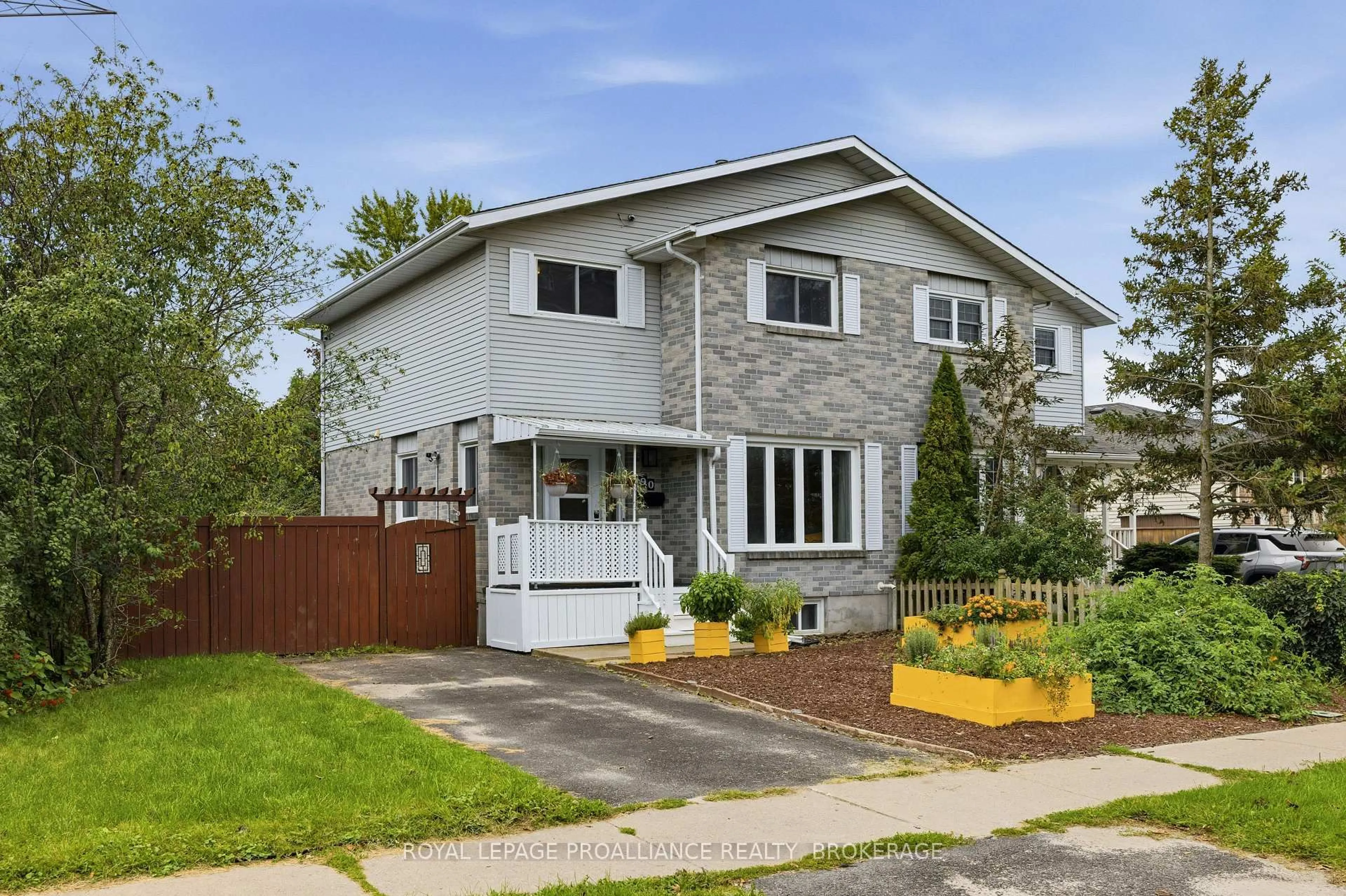 Home with vinyl exterior material, street for 690 Davis Dr, Kingston Ontario K7M 7X3