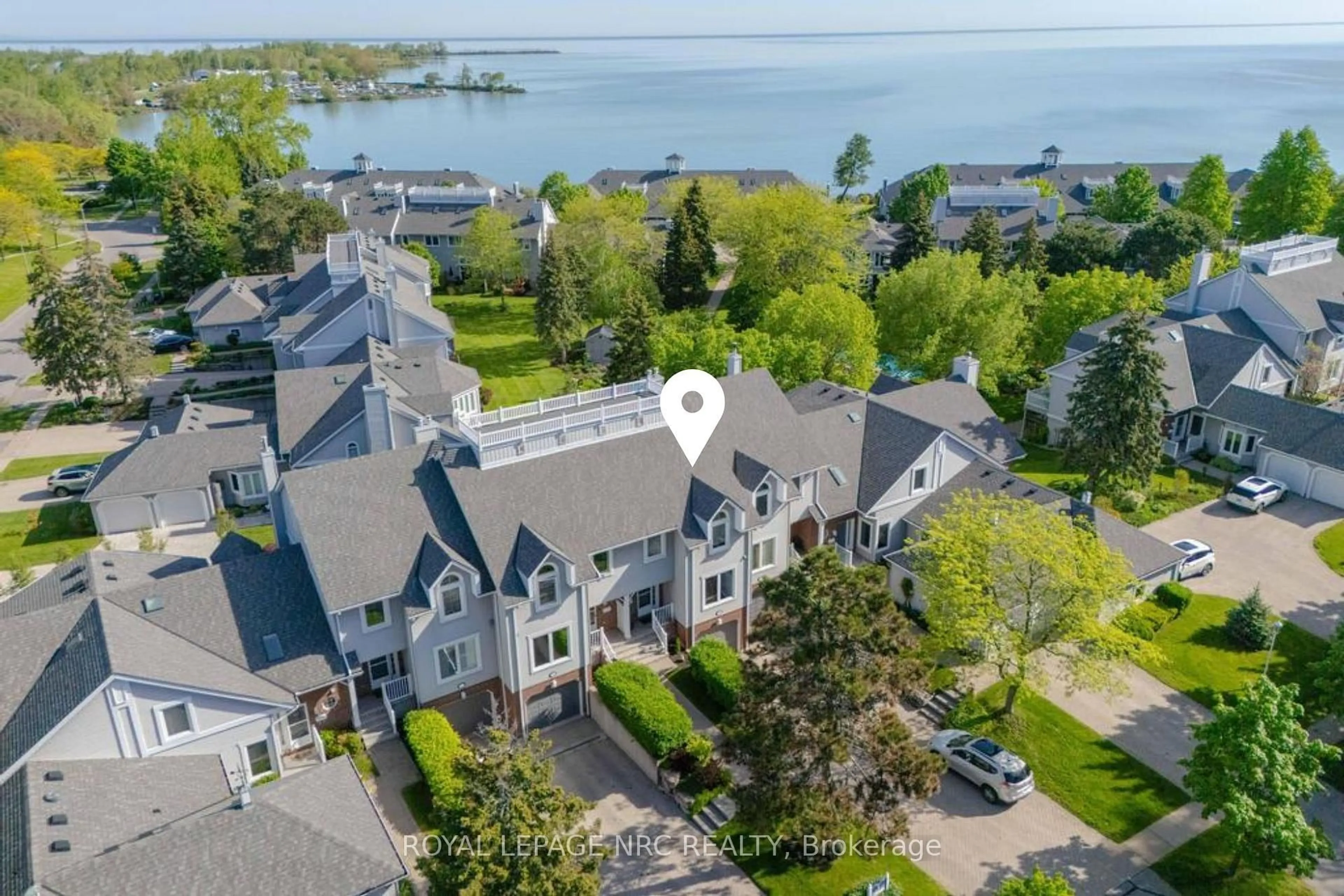 A pic from outside/outdoor area/front of a property/back of a property/a pic from drone, water/lake/river/ocean view for 1 Lakeside Dr #13, St. Catharines Ontario L2M 1P3