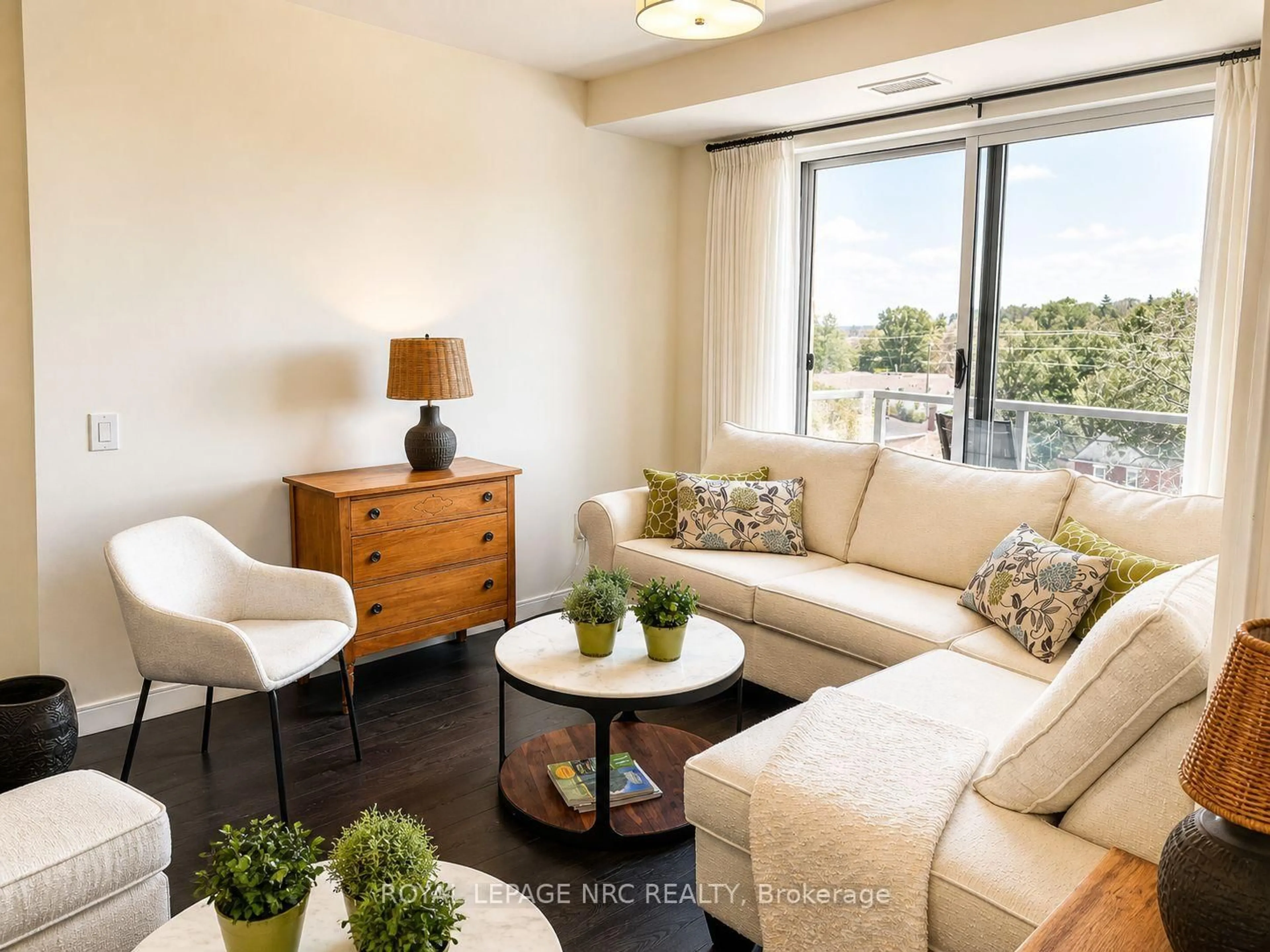 Living room with furniture, wood/laminate floor for 118 West St #604, Port Colborne Ontario L3K 4C9
