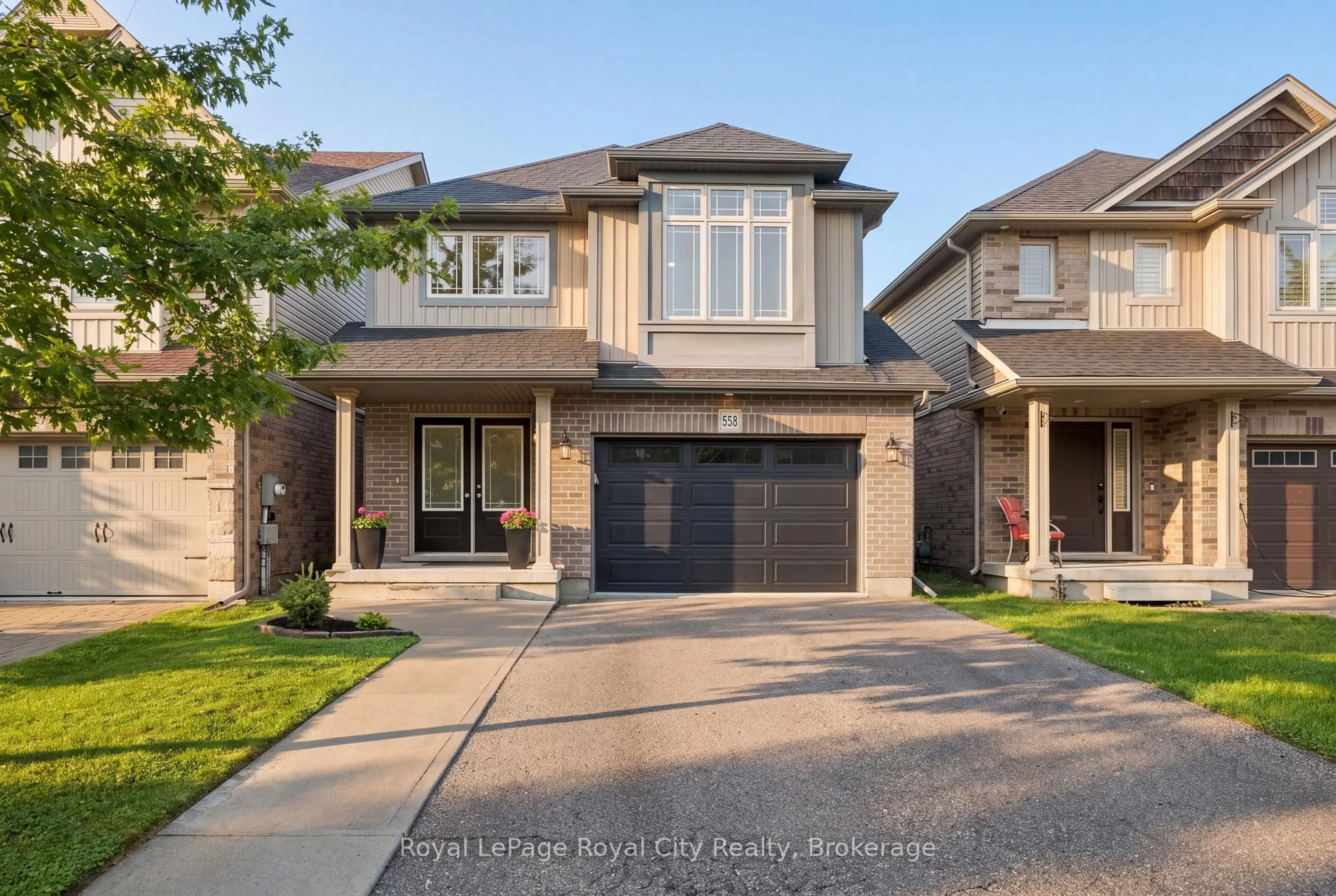 Home with brick exterior material, street for 558 Starwood Dr, Guelph Ontario N1E 0L8