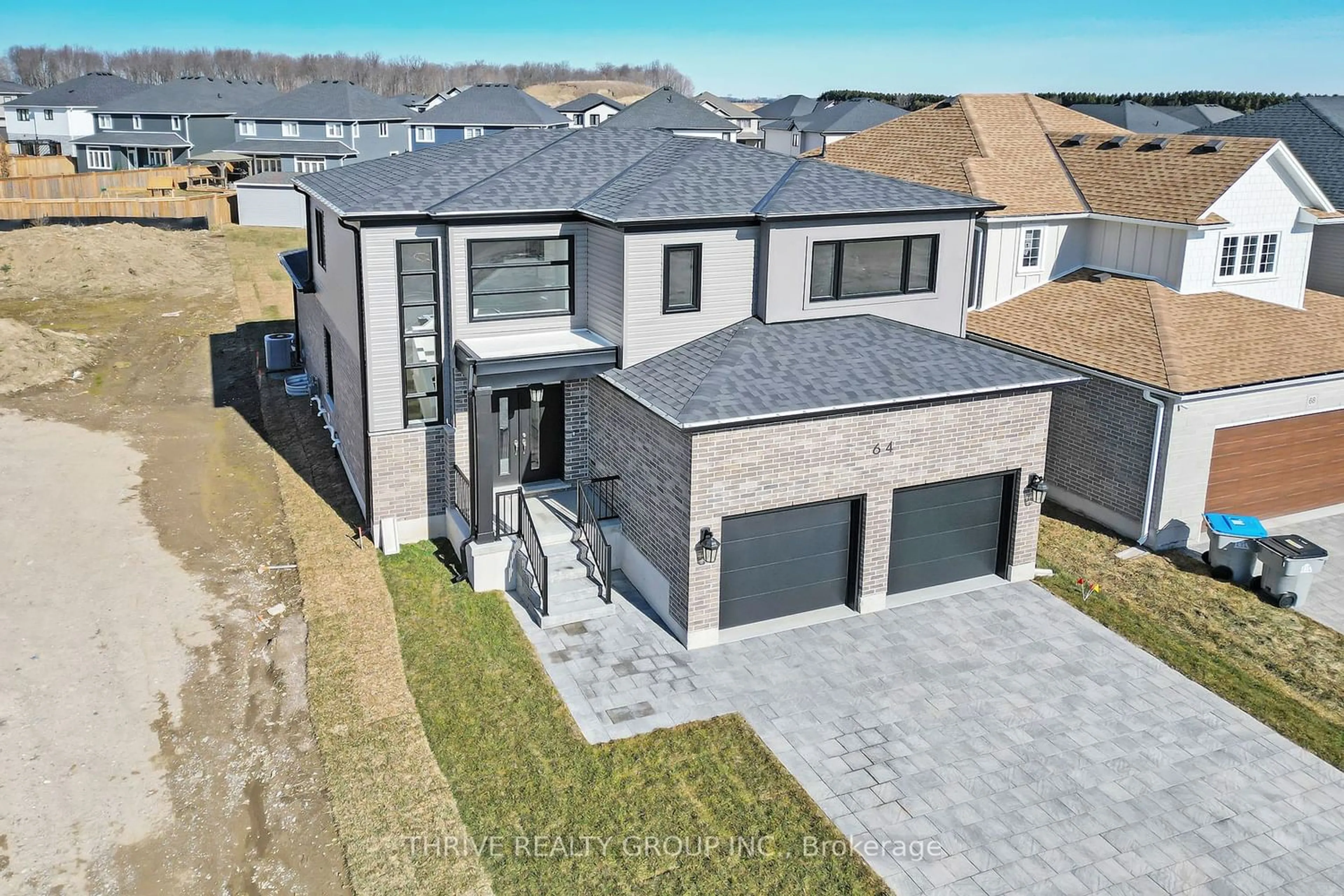 Home with brick exterior material for 64 Basil Cres, Middlesex Centre Ontario N0M 2A0