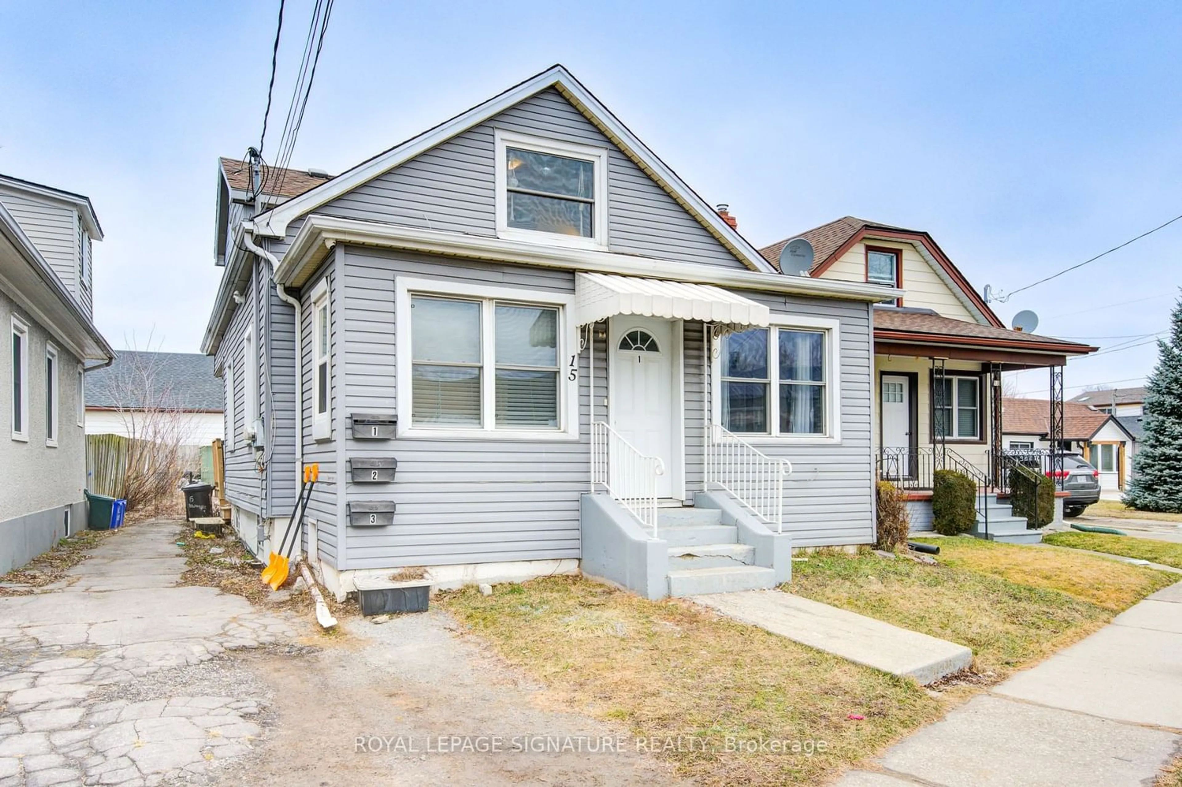 Frontside or backside of a home for 15 Delaware St, St. Catharines Ontario L2M 5L9