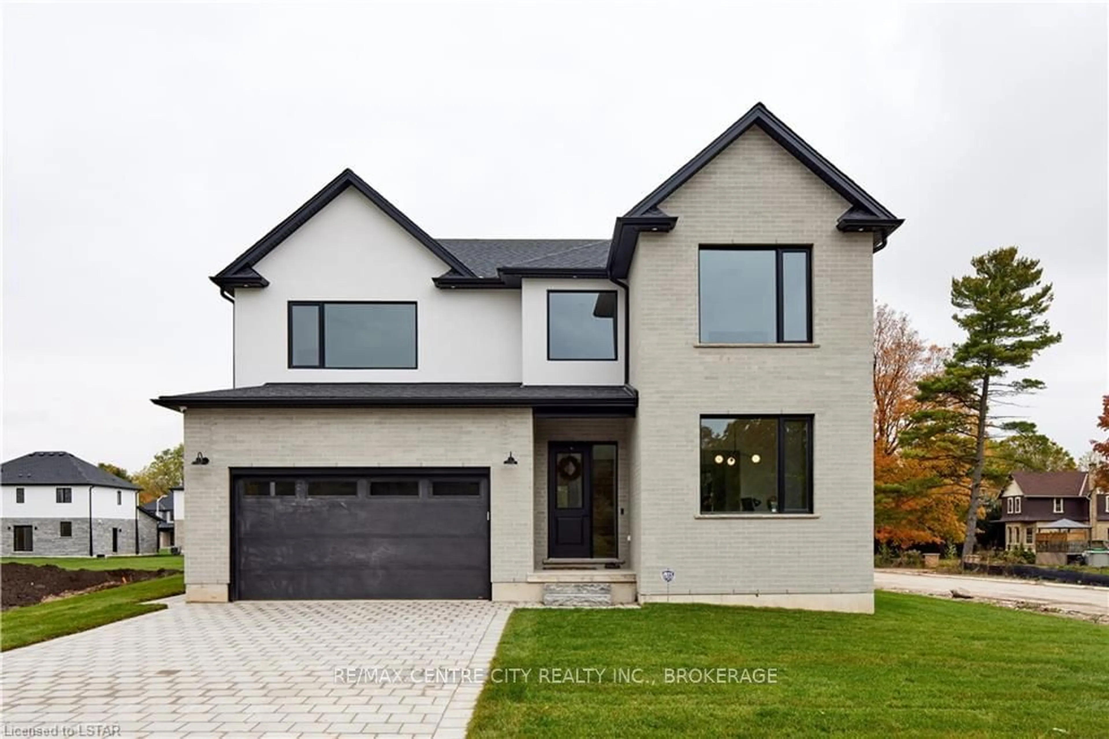 Frontside or backside of a home for 209 Merritt Crt, North Middlesex Ontario N0M 2K0