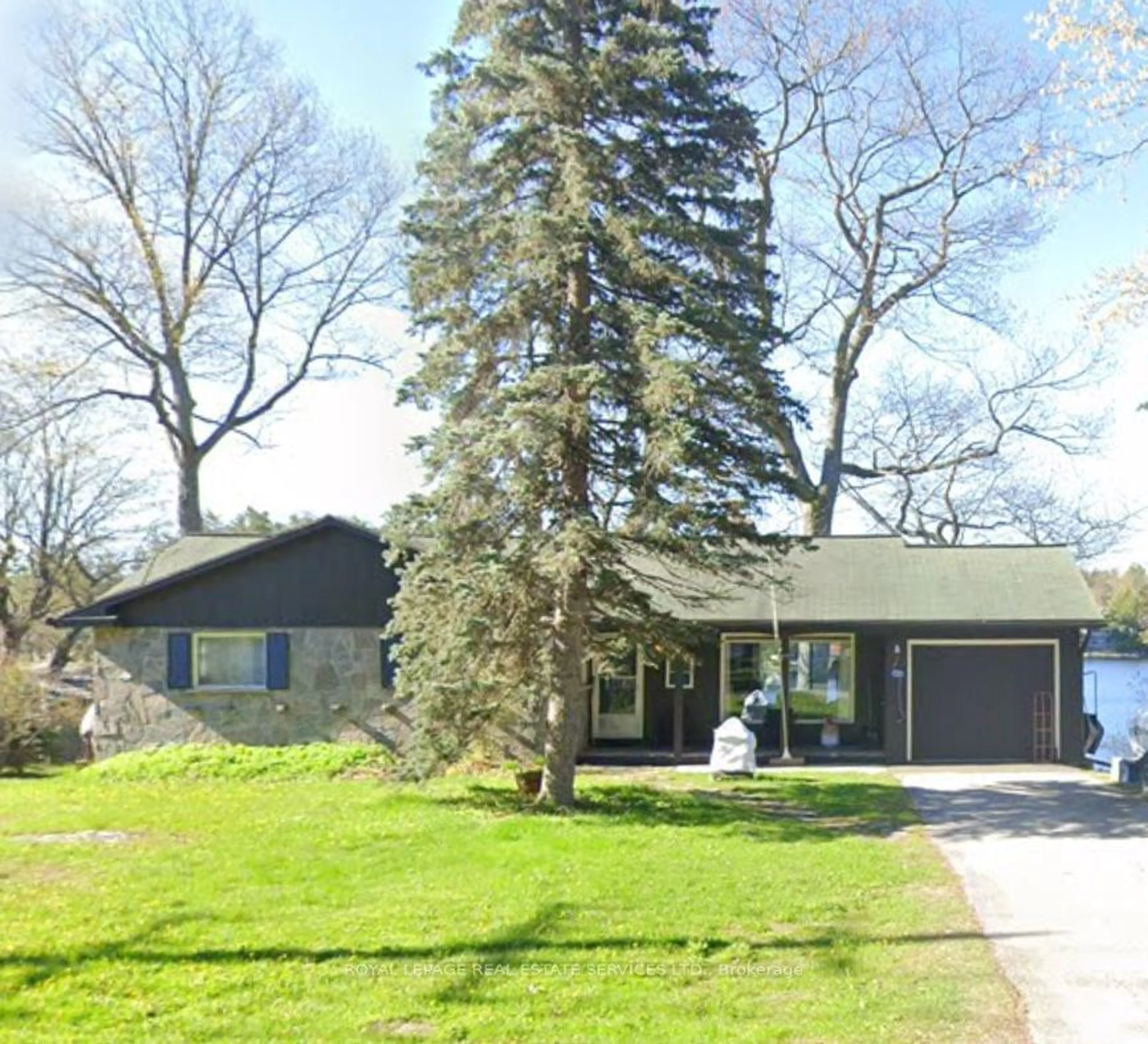 Frontside or backside of a home for 1031 River St, Muskoka Lakes Ontario P0C 1A0