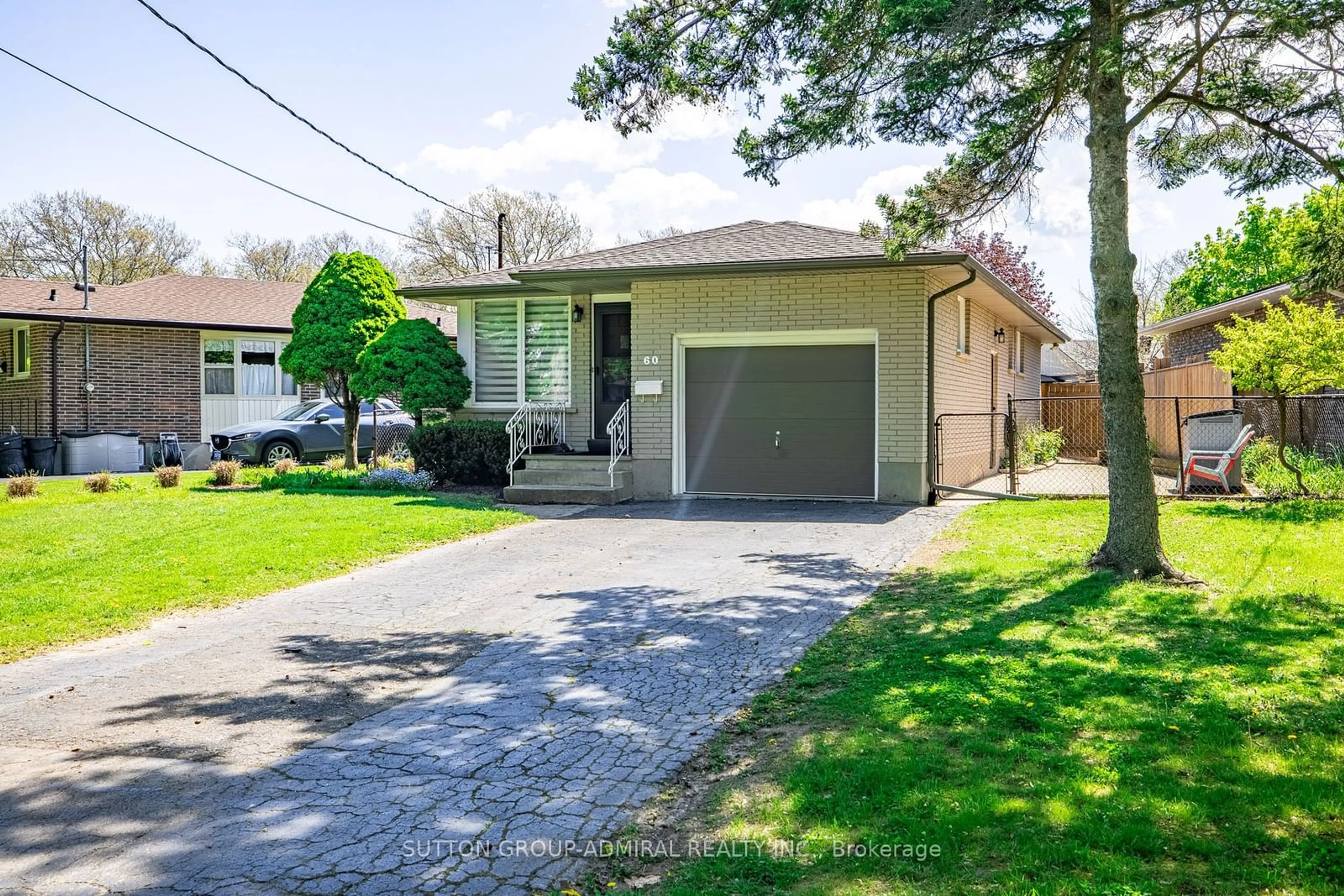 Frontside or backside of a home for 60 Pearce Ave, St. Catharines Ontario L2M 6N4