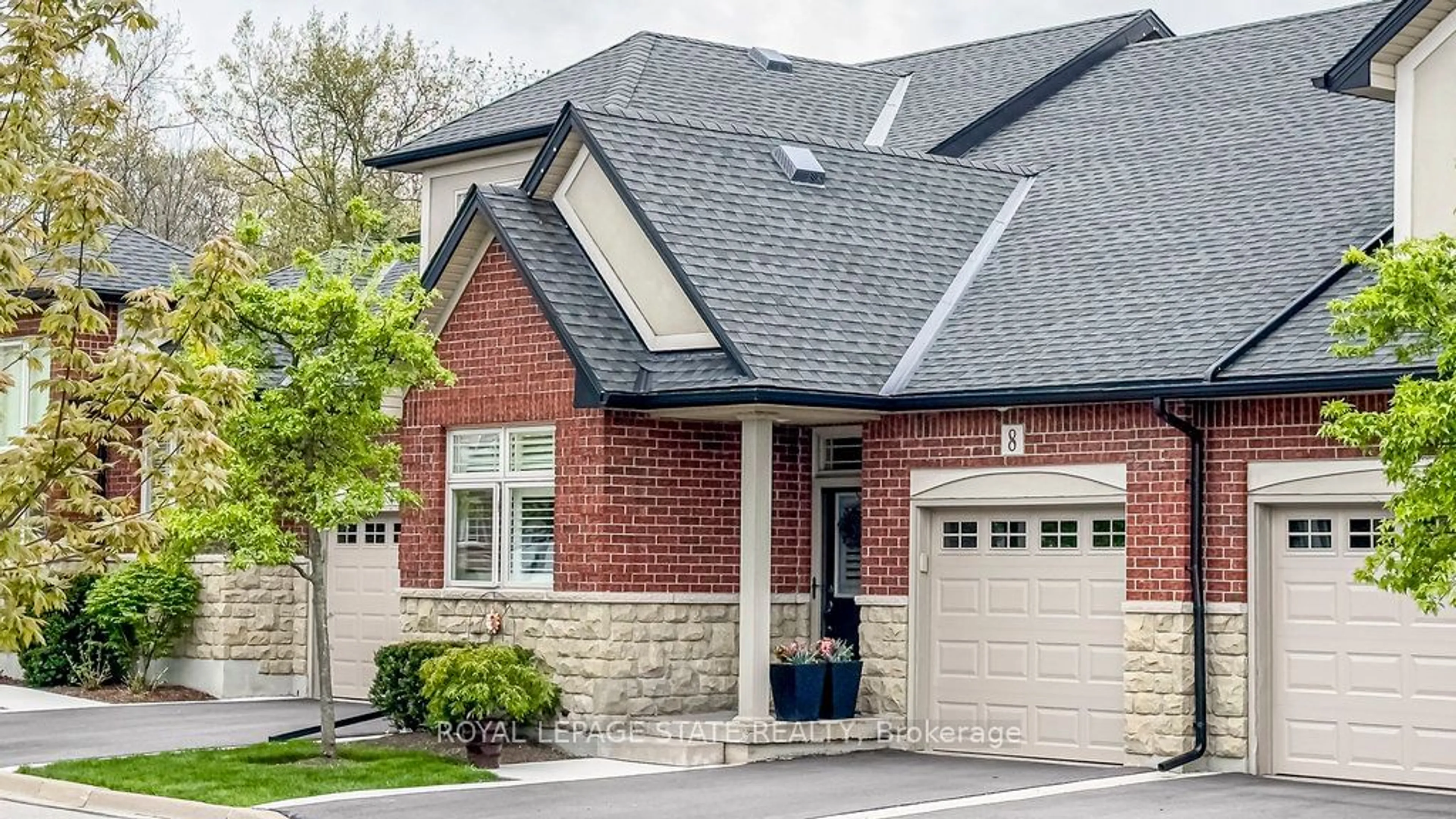 Home with brick exterior material for 8 Carmichael Tr, Hamilton Ontario L9K 0A1