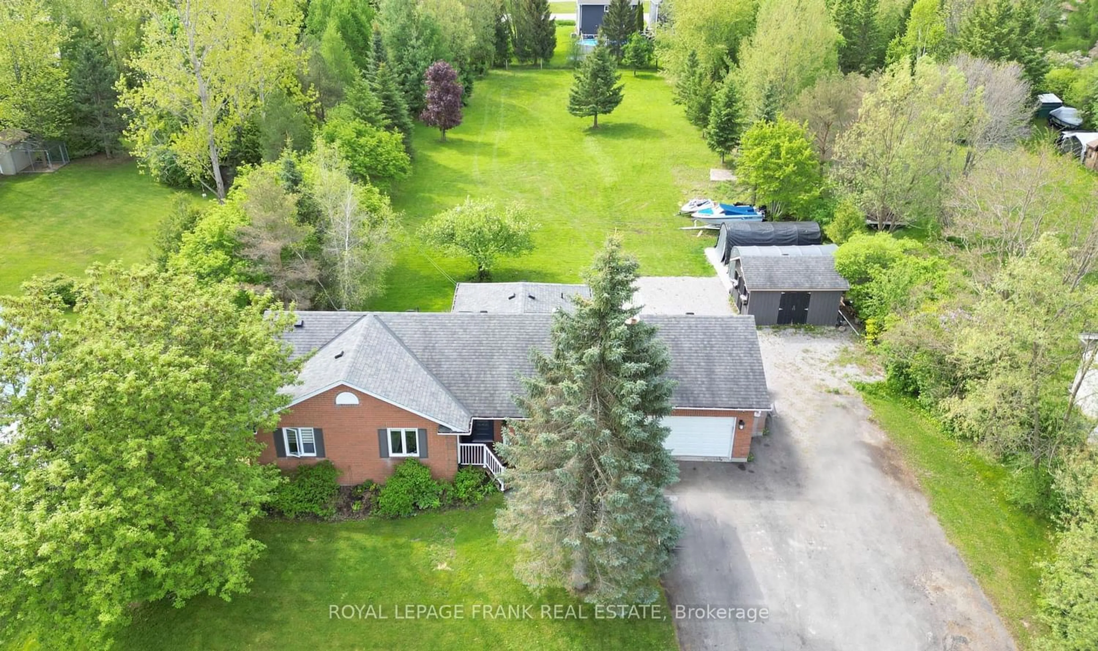 Frontside or backside of a home, the fenced backyard for 42 Pigeon Lake Rd, Kawartha Lakes Ontario K9V 4R6