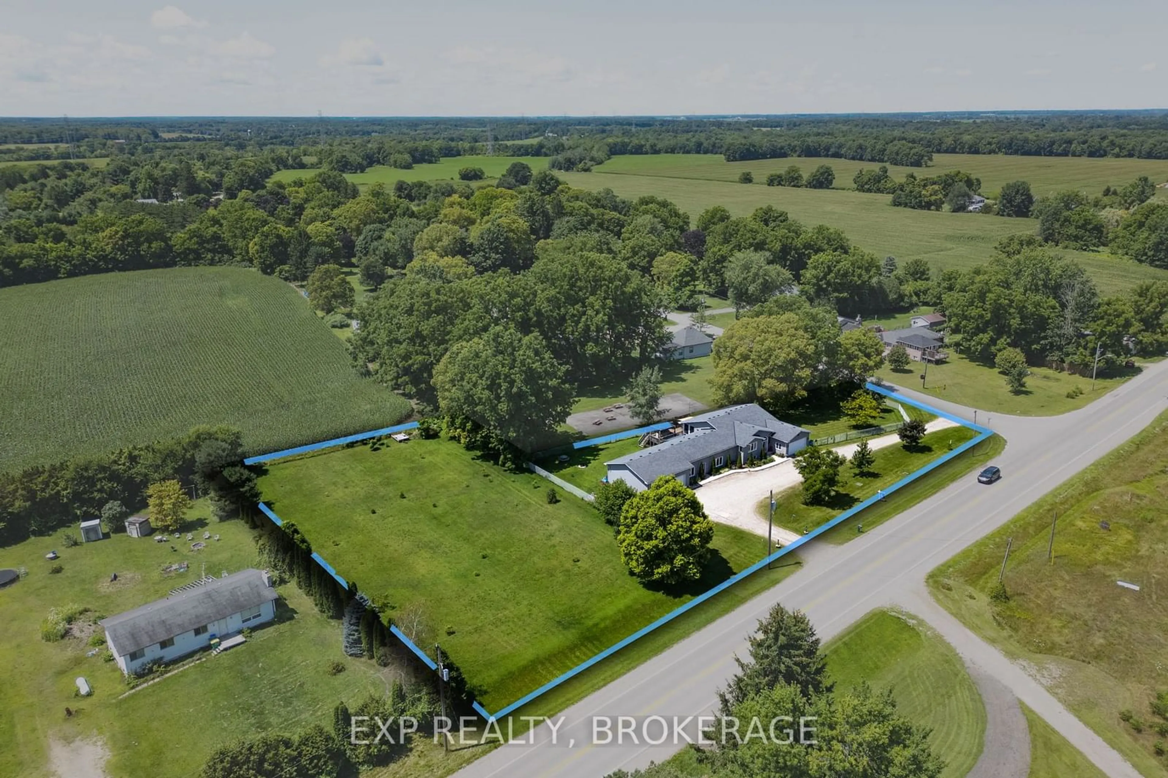 Frontside or backside of a home, the fenced backyard for 20437 MELBOURNE Rd, Southwest Middlesex Ontario N0L 1T0