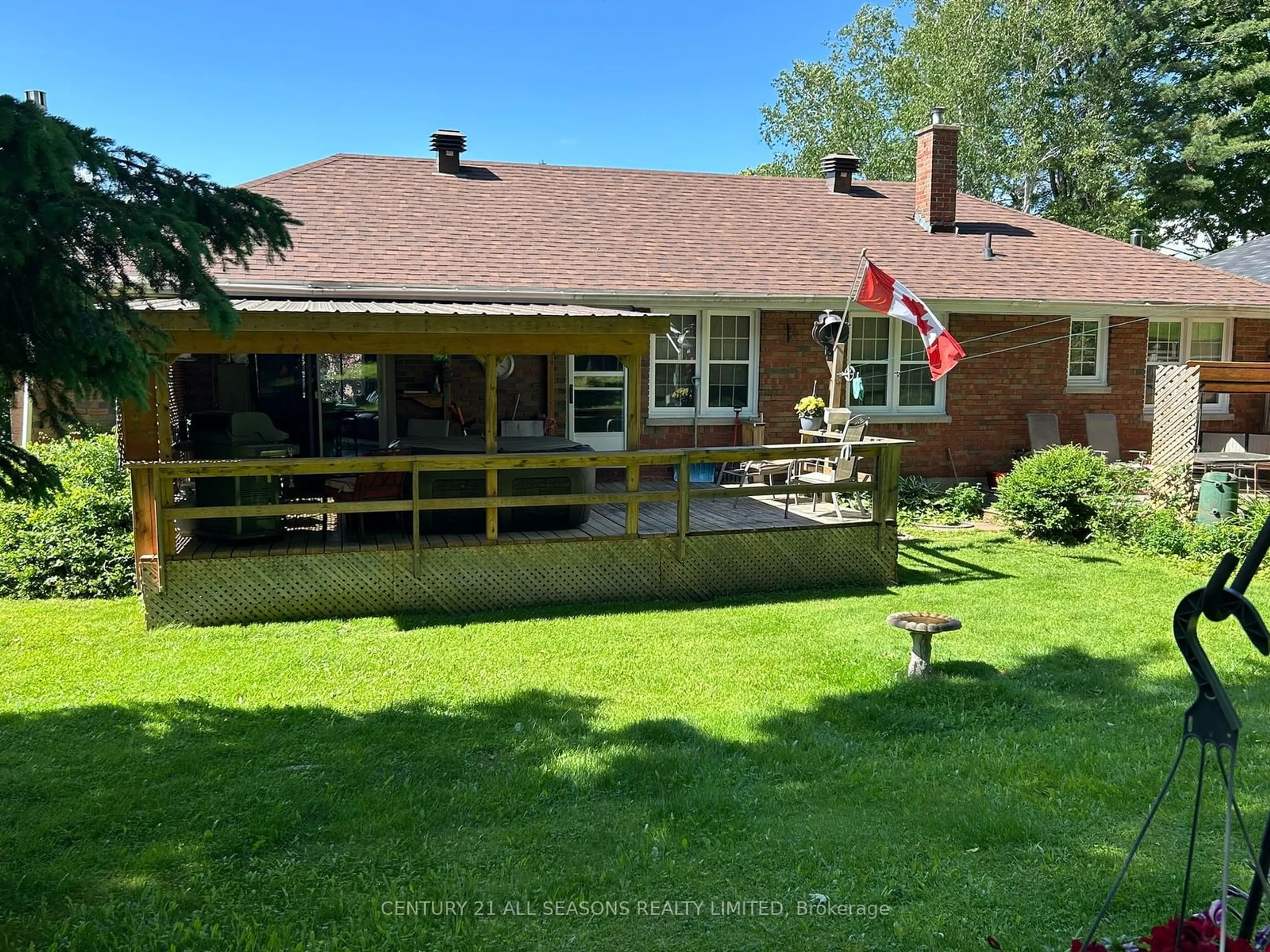 Frontside or backside of a home, the fenced backyard for 78 Maple St, Bancroft Ontario K0L 1C0