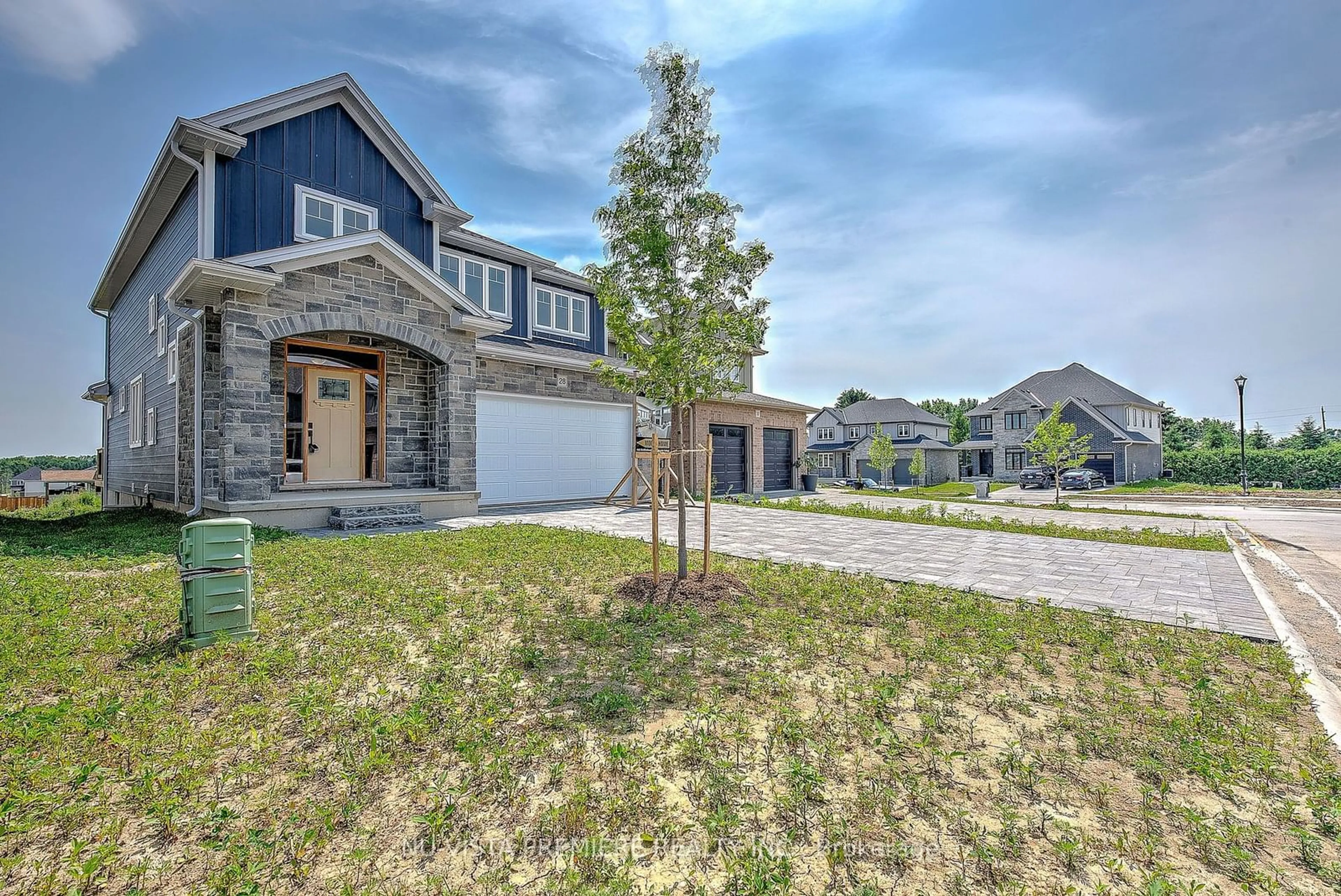 A pic from exterior of the house or condo, the street view for 28 Basil Cres, Middlesex Centre Ontario N0M 2A0