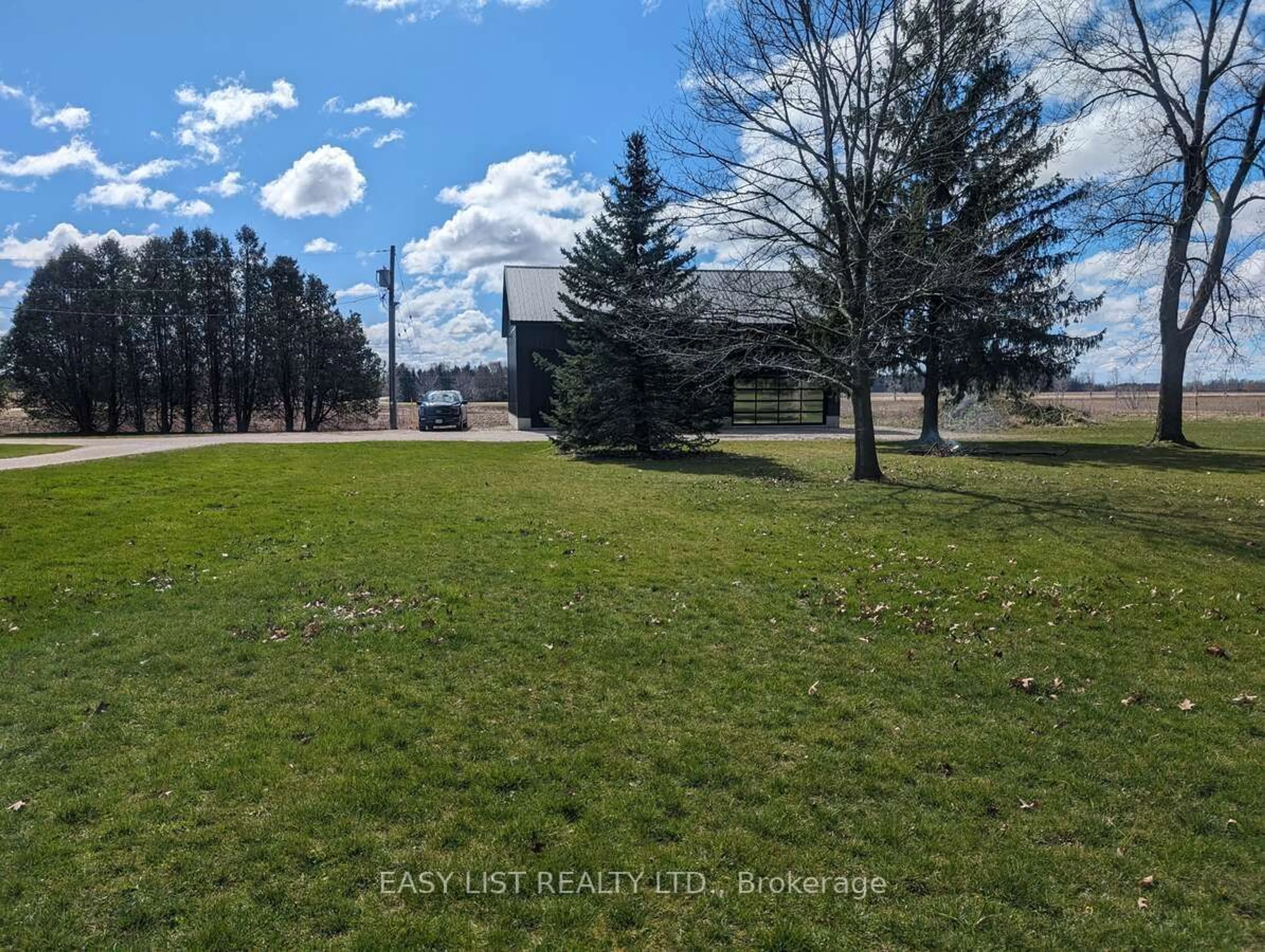 A pic from exterior of the house or condo, the fenced backyard for 22445 Fairview Rd, Thames Centre Ontario N0M 2P0