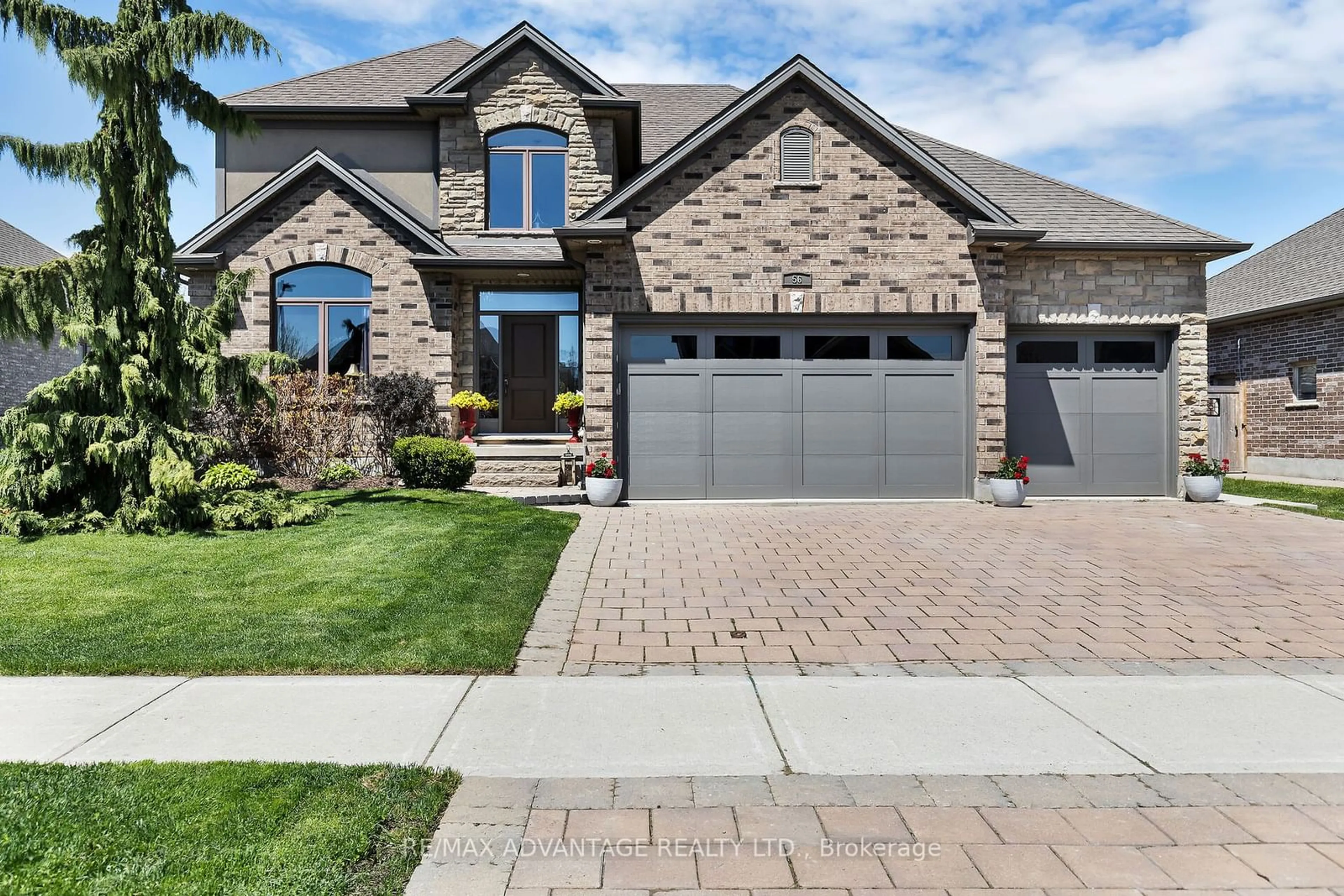 Home with brick exterior material for 56 Blue Heron Dr, Middlesex Centre Ontario N0M 2A0