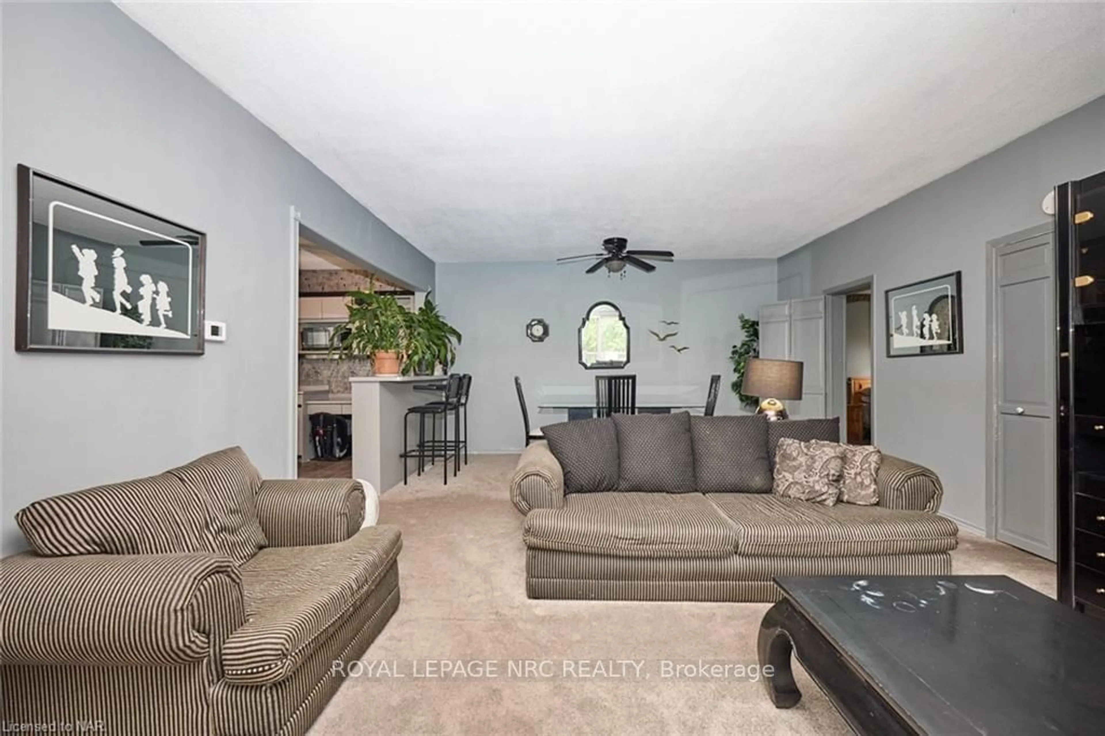 Living room, carpet floors for 84 Merritt St, St. Catharines Ontario L2T 1J6