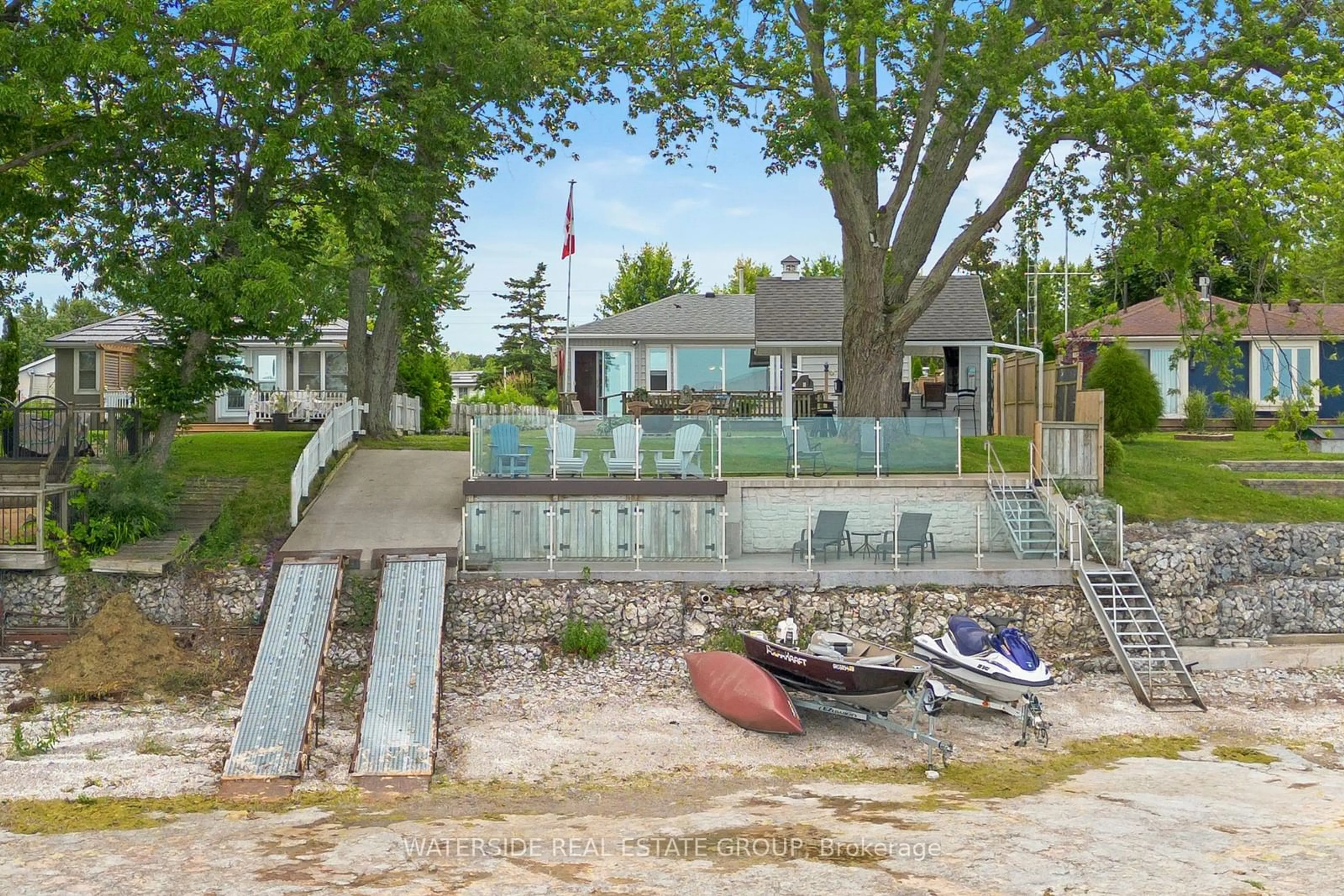 Frontside or backside of a home, the fenced backyard for 44 Hoover Point Lane, Haldimand Ontario N0A 1P0