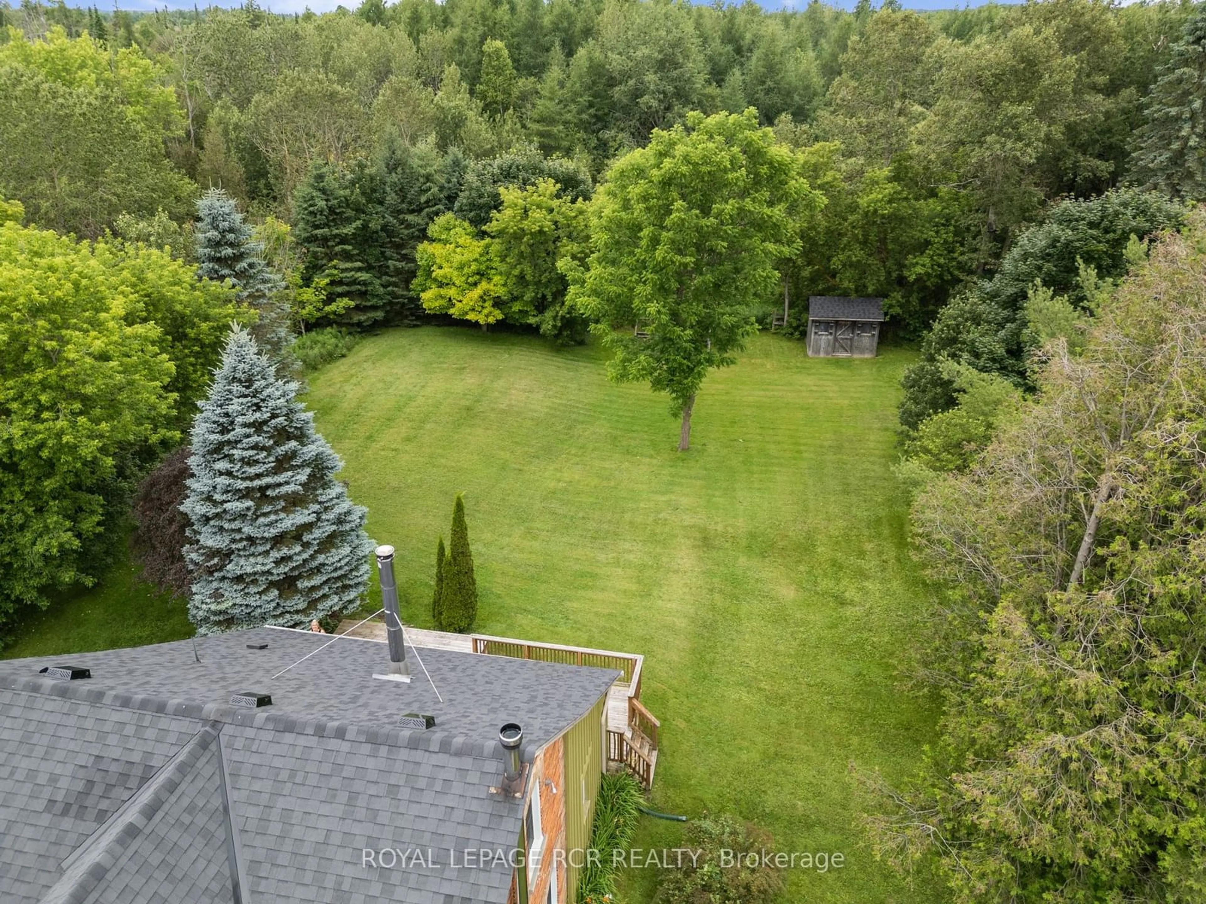 A pic from exterior of the house or condo, the fenced backyard for 22021 E GARA-ERIN TLINE, East Garafraxa Ontario L9W 7G4