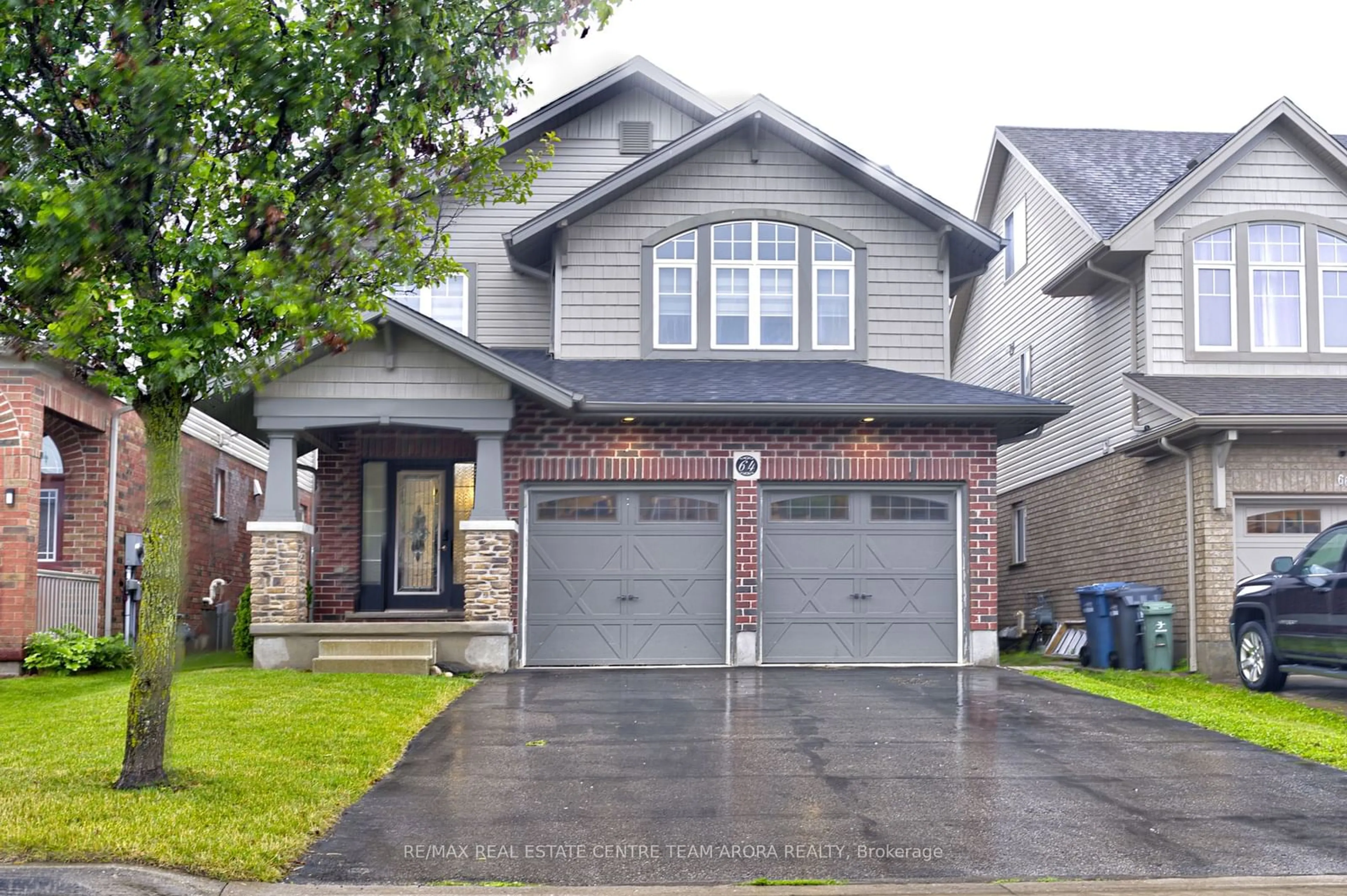 Frontside or backside of a home for 64 Laughland Lane, Guelph Ontario N1L 0C6