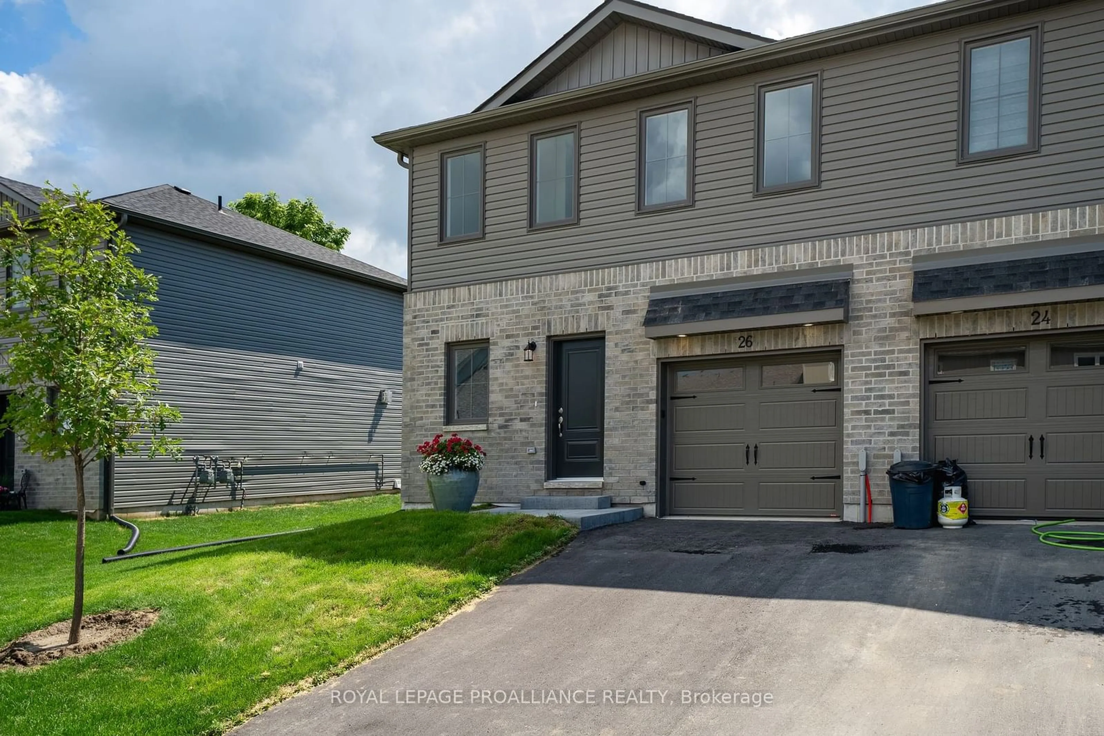 Frontside or backside of a home, the street view for 26 Campbell Cres, Prince Edward County Ontario K0K 2T0