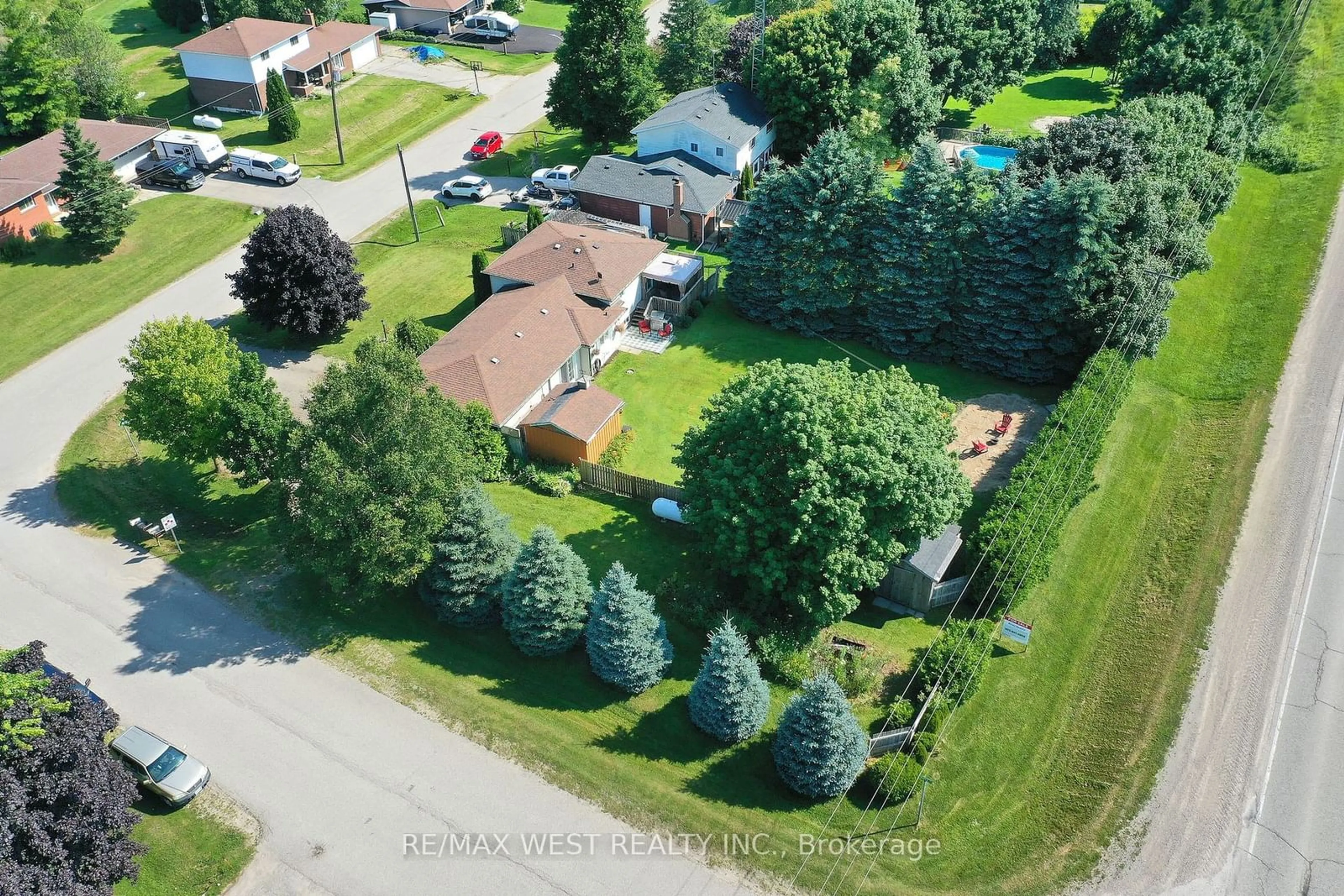 Frontside or backside of a home, the fenced backyard for 27 Victoria Blvd, East Garafraxa Ontario L9W 7L6