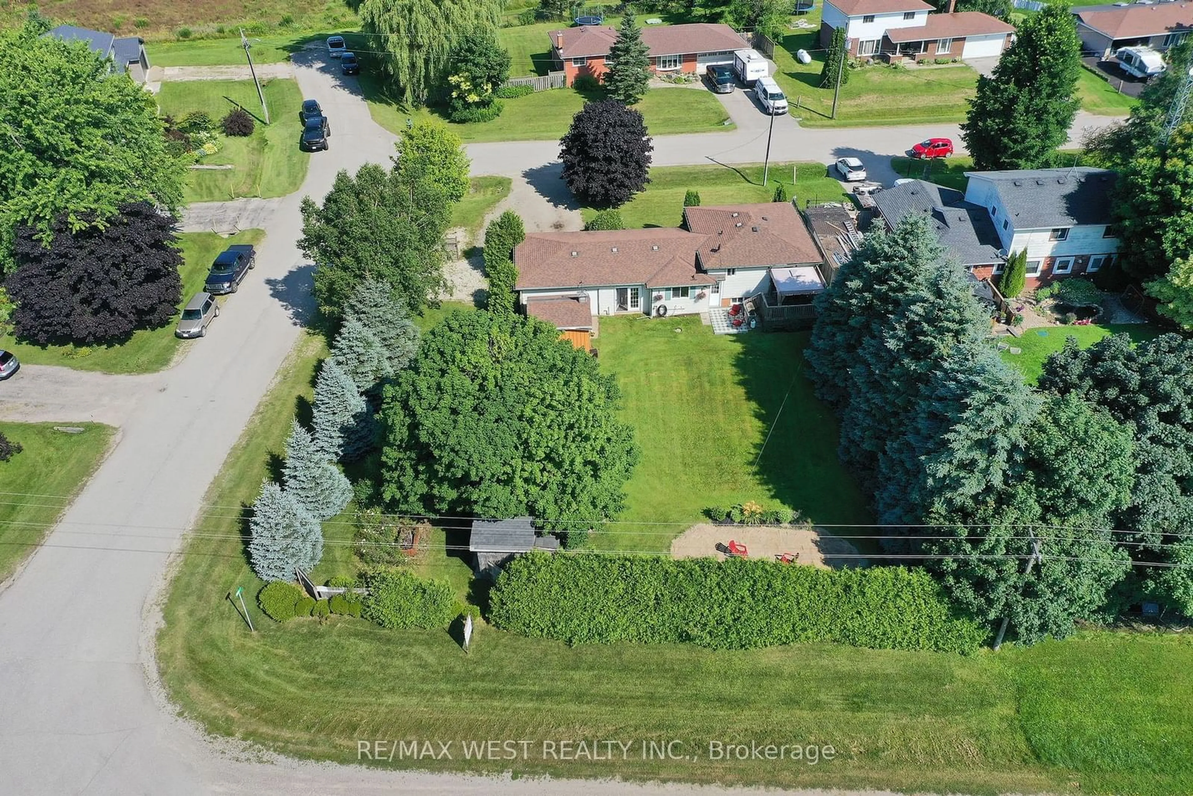 Frontside or backside of a home, the fenced backyard for 27 Victoria Blvd, East Garafraxa Ontario L9W 7L6