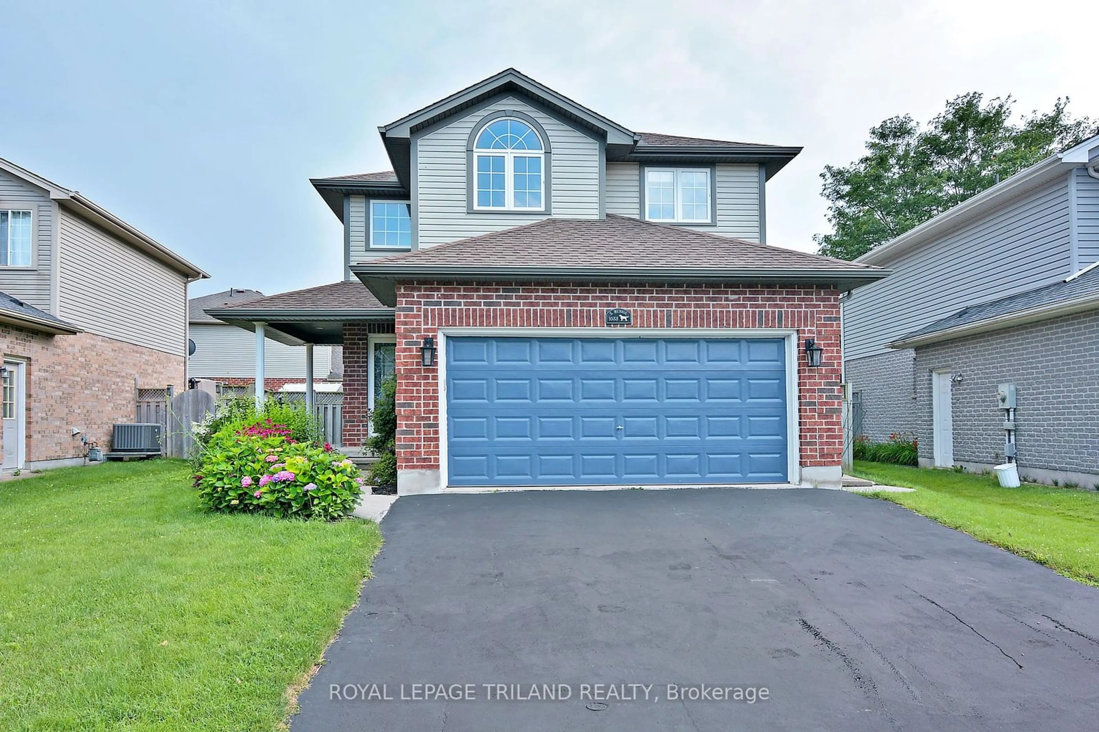 Frontside or backside of a home for 1033 South Wenige Dr, London Ontario N5X 4G4
