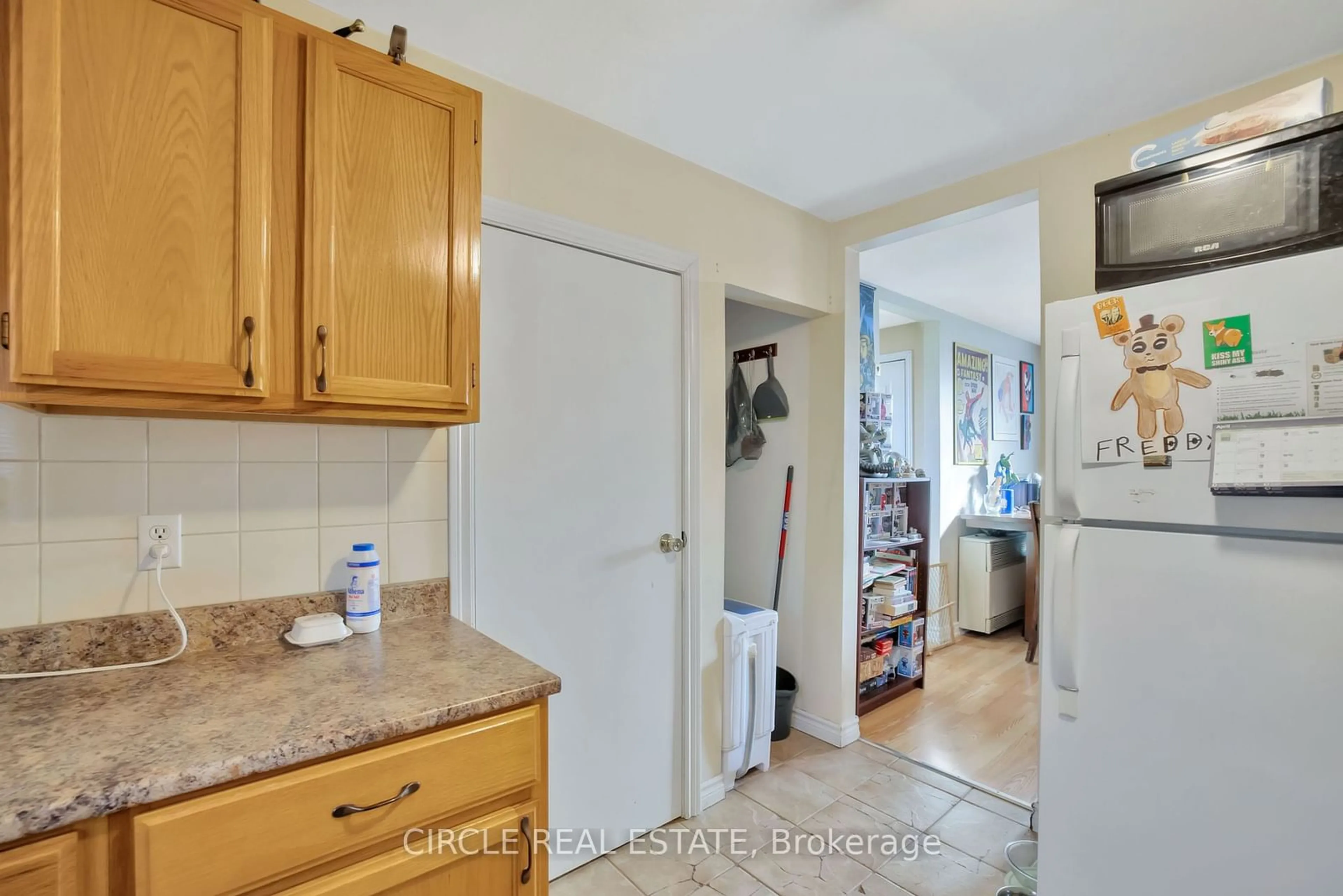 Kitchen with laundary machines for 1162 Richmond St #1160, Windsor Ontario N9A 4A4